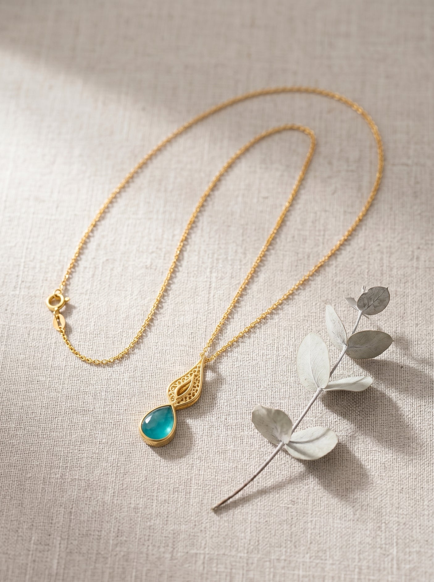 Nature Inspired Gold Pendant Necklace with Blue Crystal