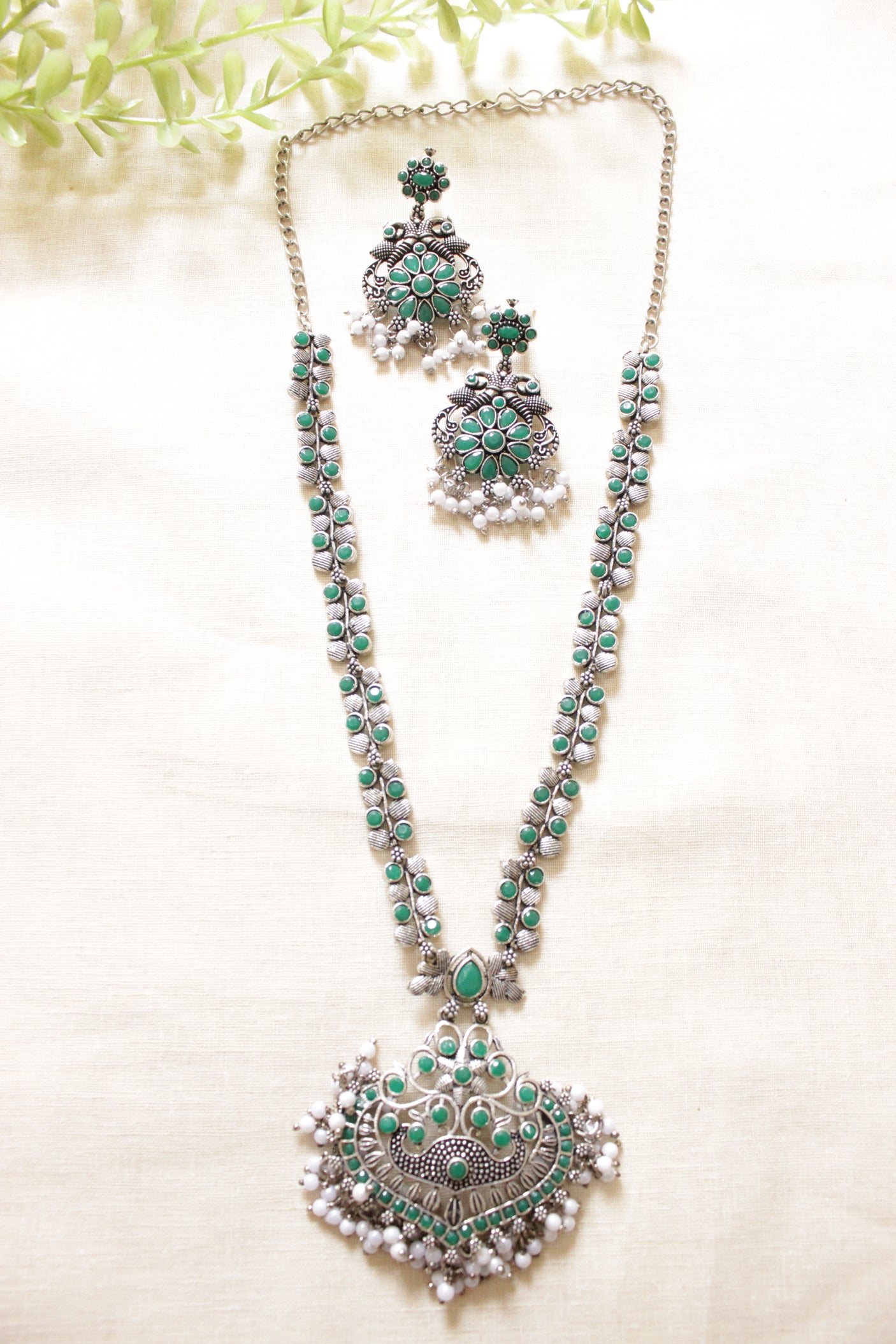 Green Glass Stones Embedded Silver Finish Peacock Motifs Chain Necklace Set