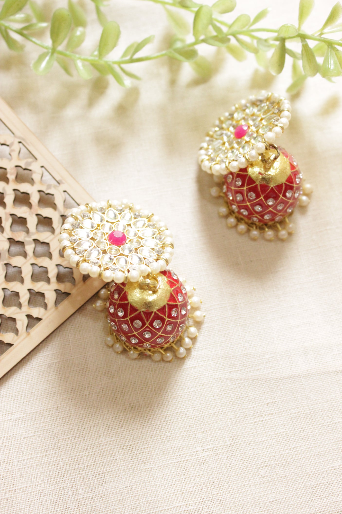 Red Hand Painted Meenakari Work Gold Toned Jhumka Earrings