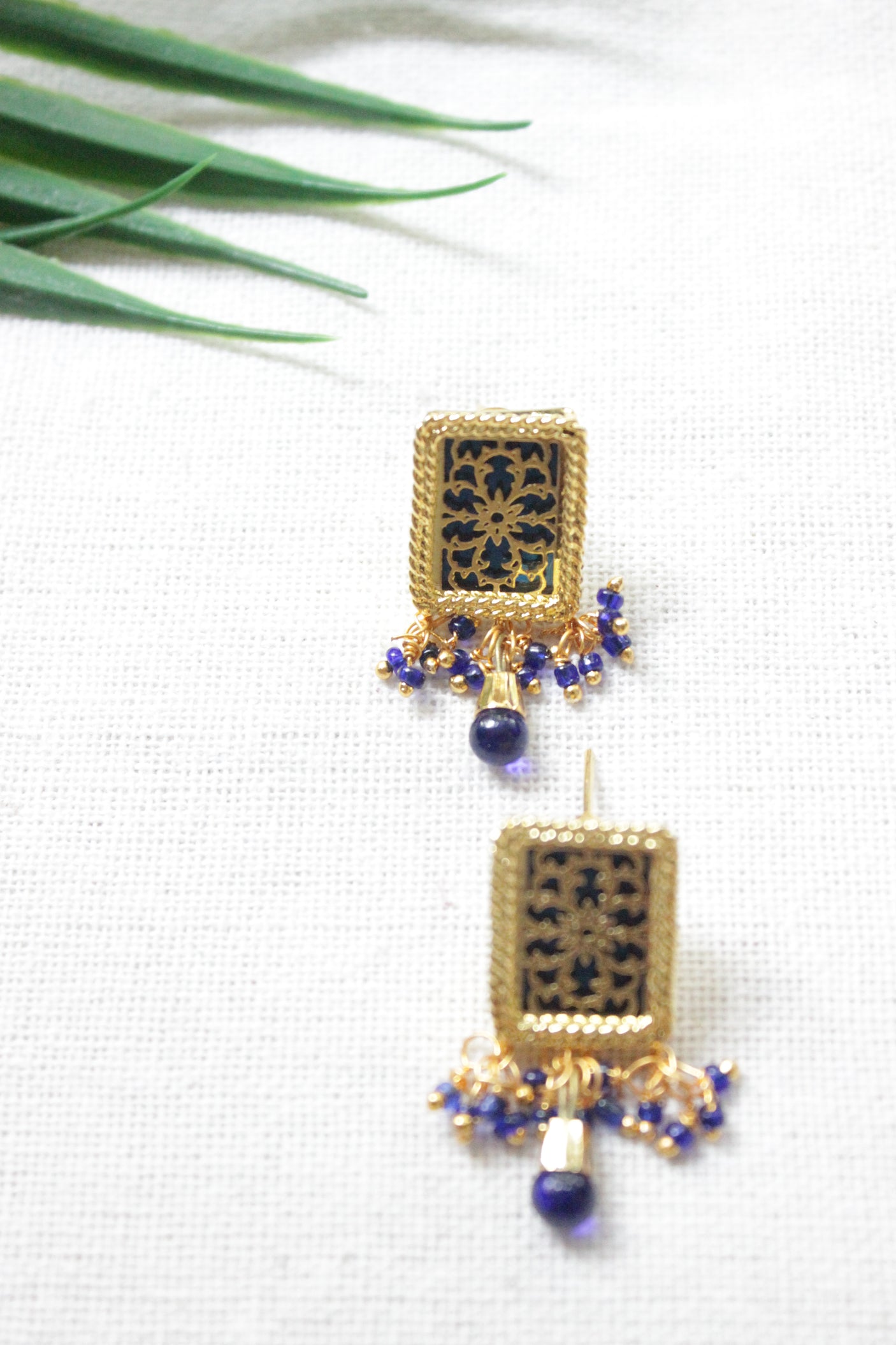 Intricately Detailed Gold Toned Rectangular Pendant Necklace Set with Multi-Layer Blue Beads Closure