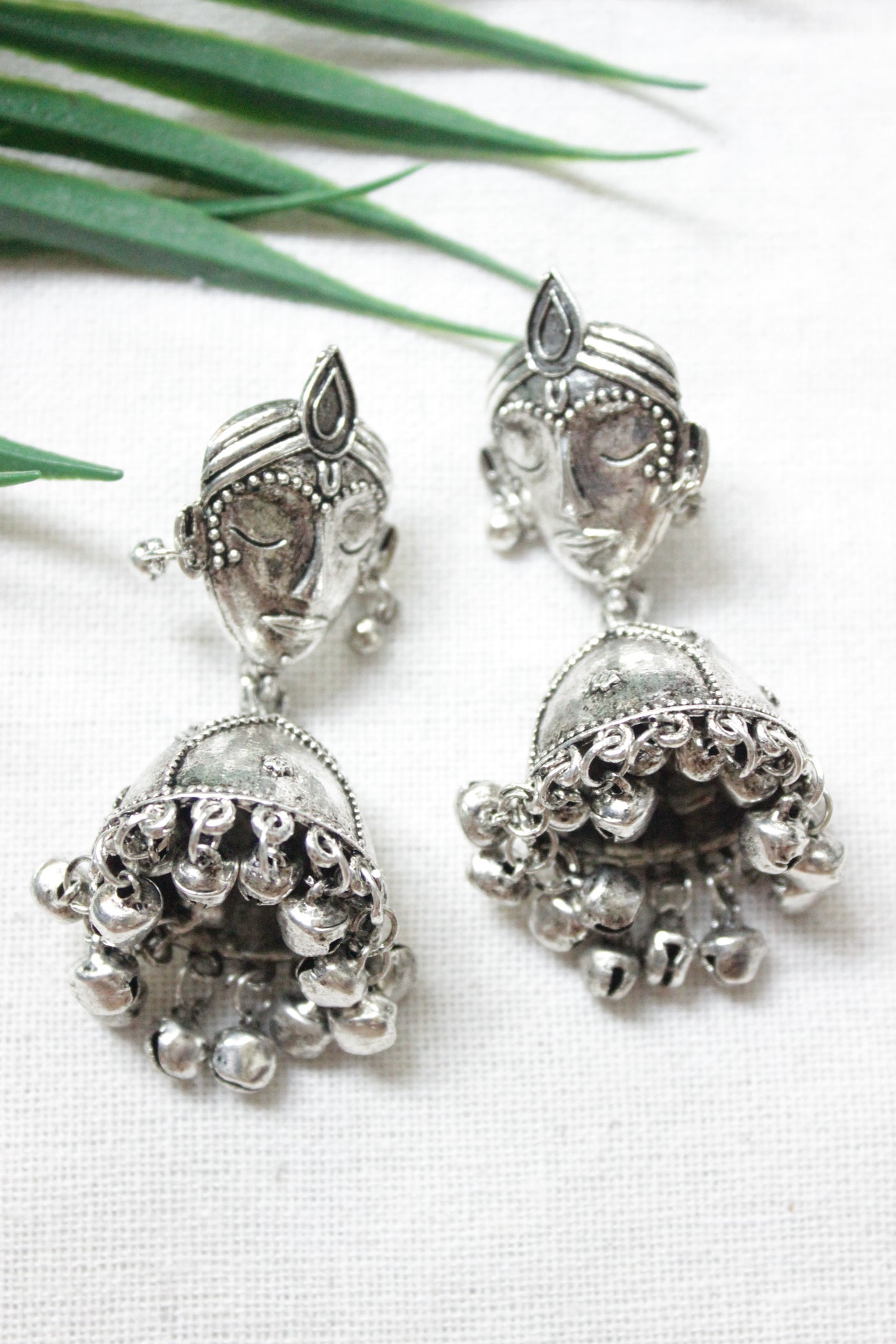 Buddha Motif Oxidised Finish Jhumka Earrings