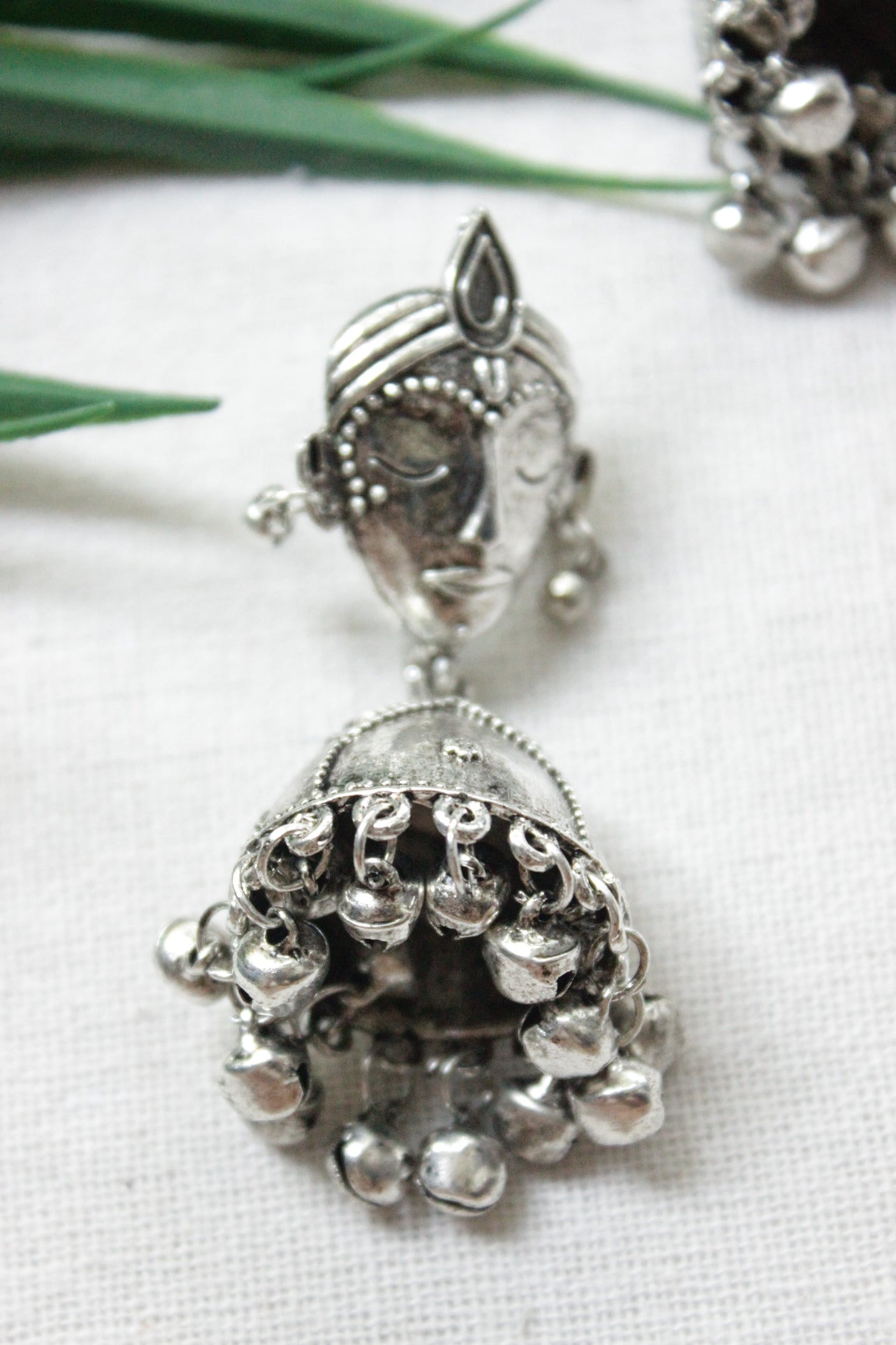Buddha Motif Oxidised Finish Jhumka Earrings