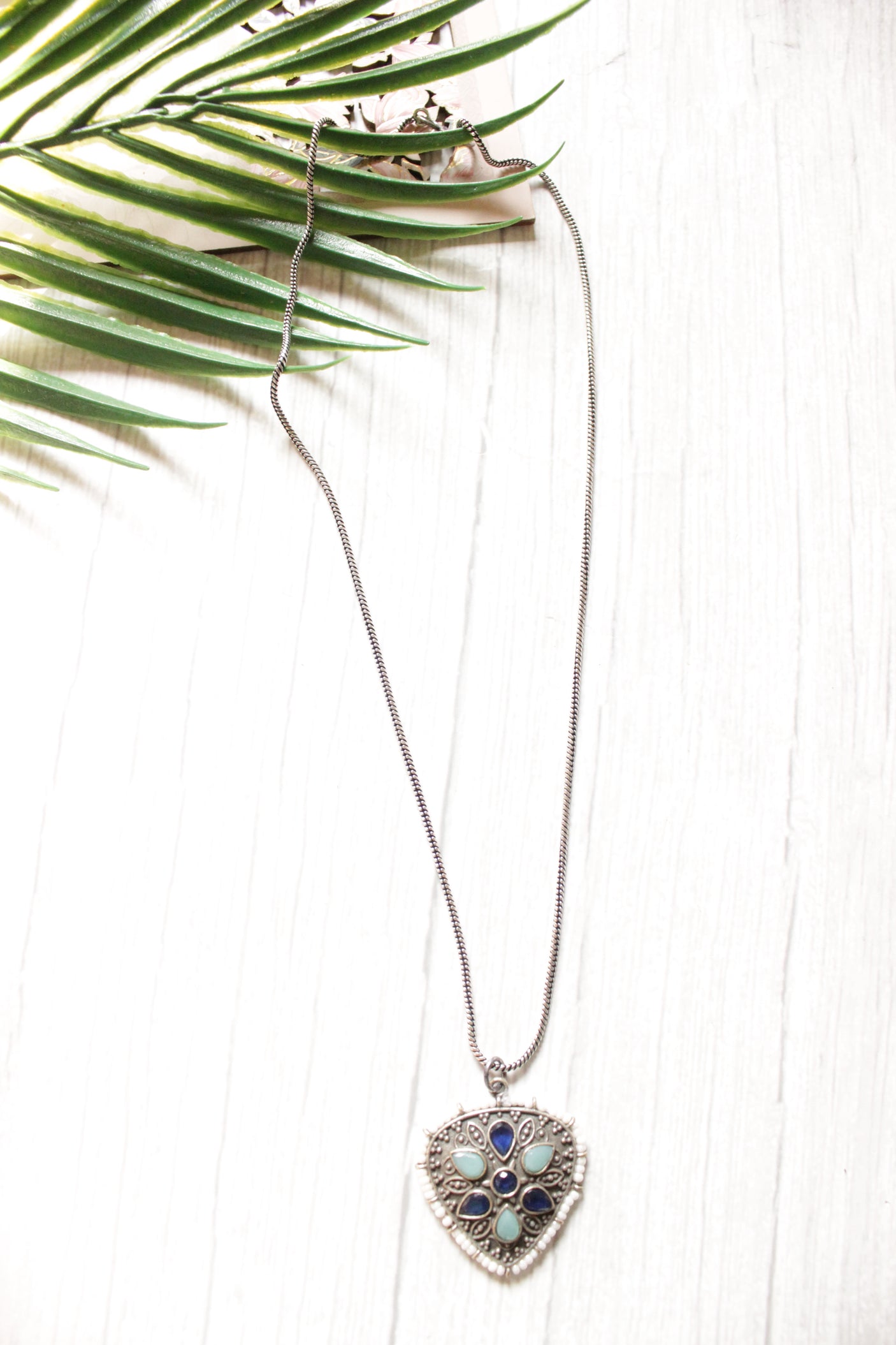 Premium Oxidised Finish Metal Pendant Necklace Embedded with Turquoise & Purple Stones