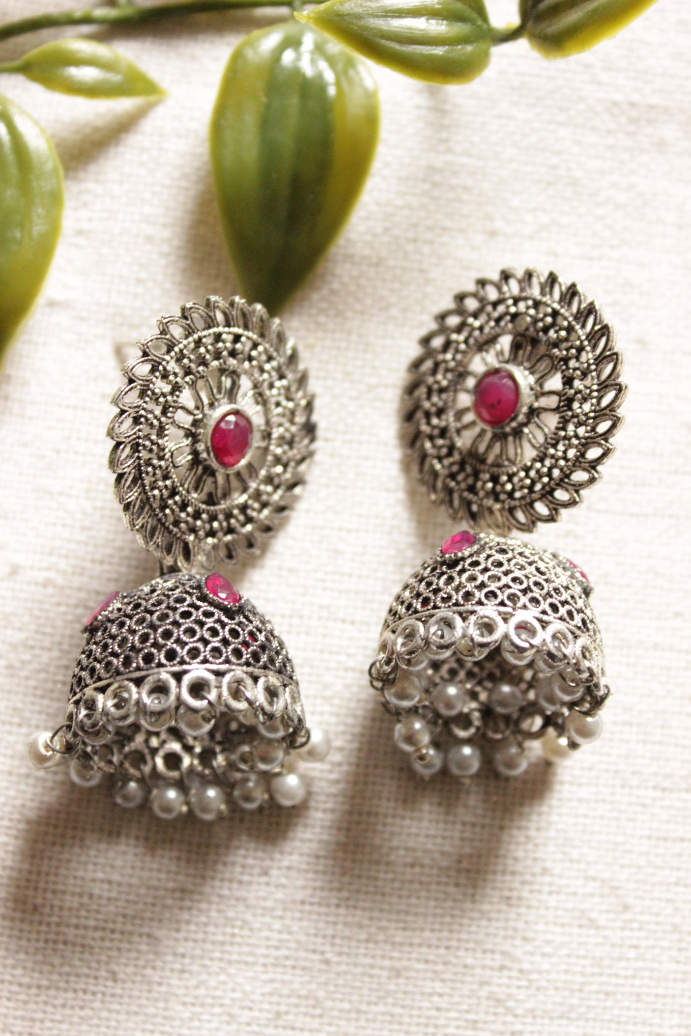 Jaali Pattern Pink Center Stone Silver Finish Jhumka Earrings