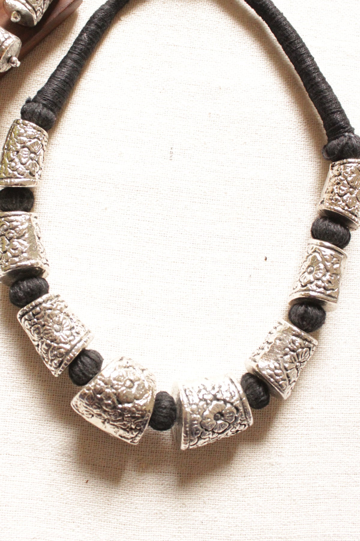 Intricately Detailed Metal Accents Braided with Black Fabric Threads Necklace Set