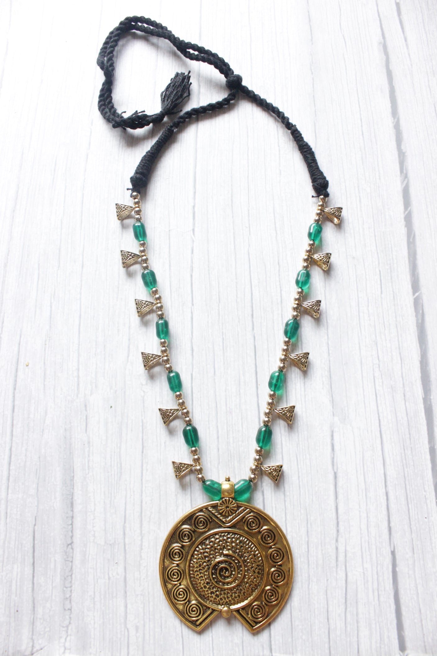 Gold Finish Metal Pendant Necklace Accentuated with Green Glass Beads