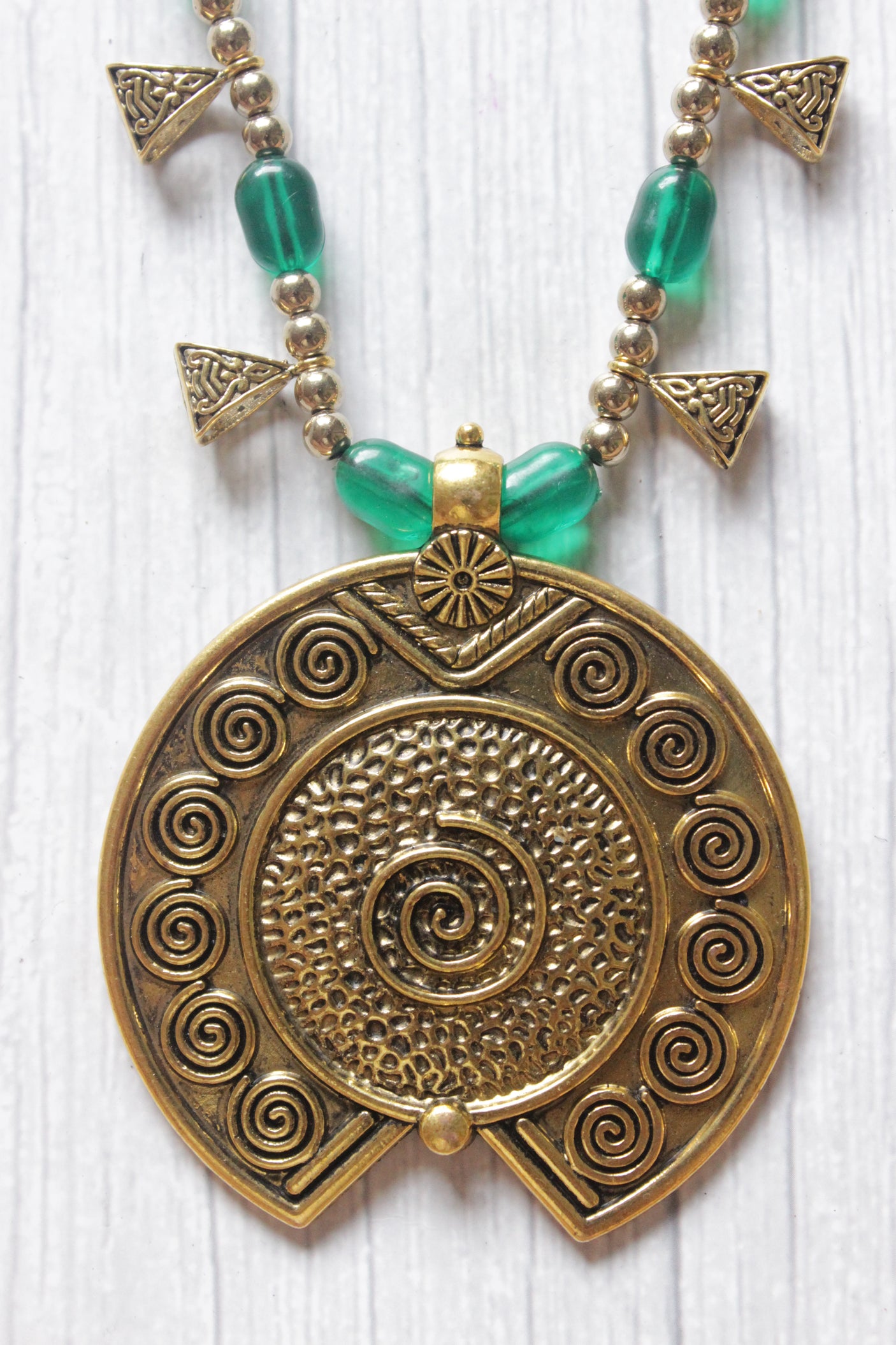 Gold Finish Metal Pendant Necklace Accentuated with Green Glass Beads