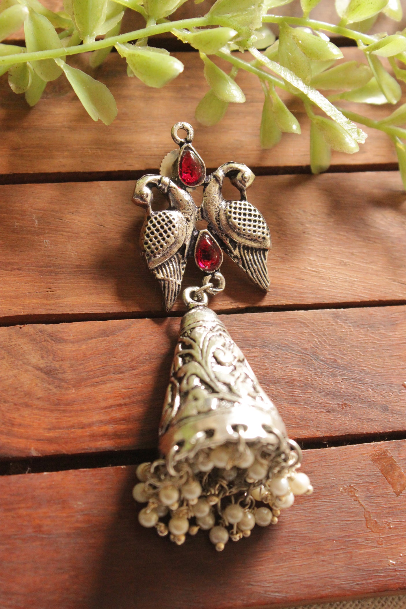 Red Glass Stones Embedded Oxidised Finish Bird Dangler Earrings