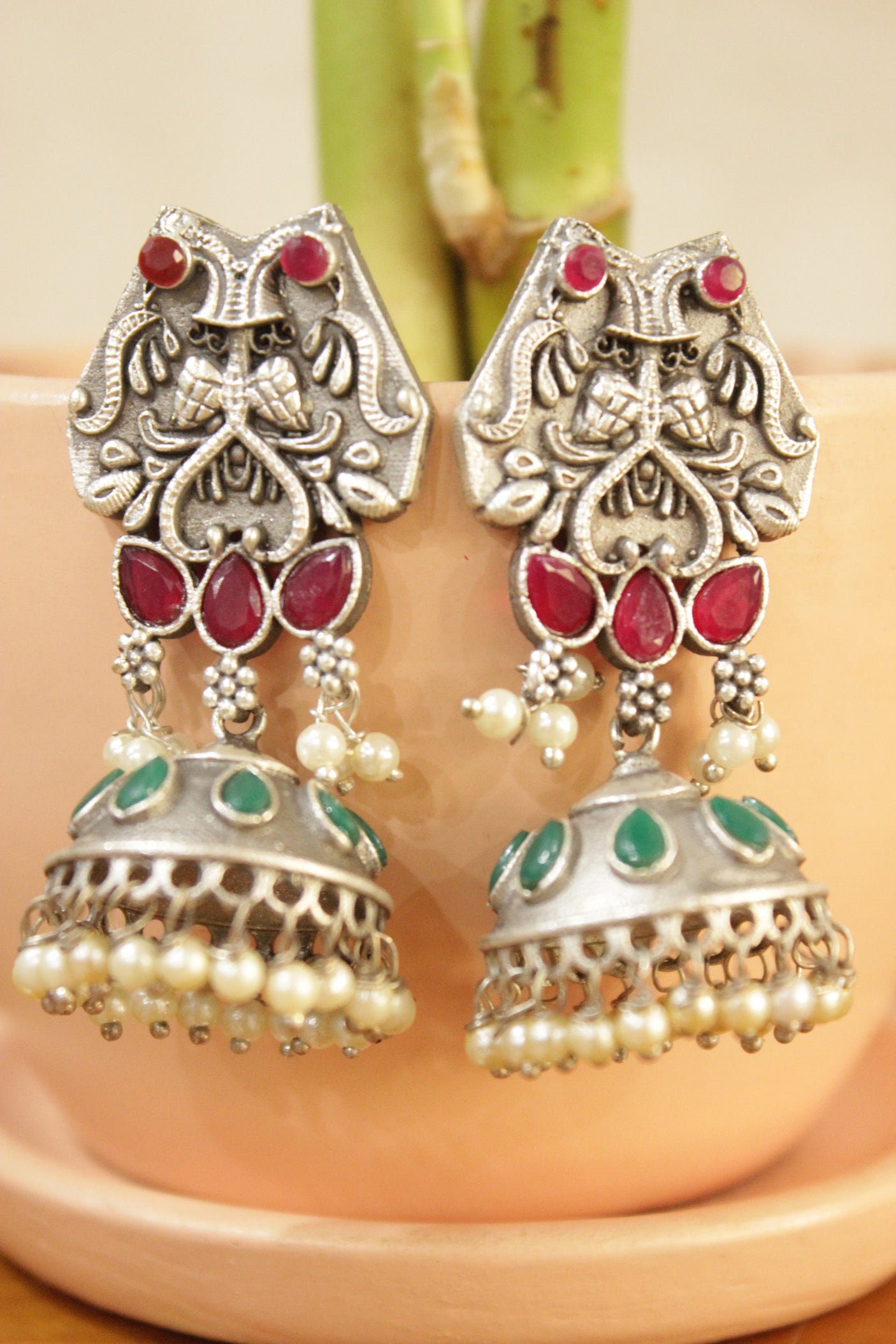 Ruby Red & Green Natural Gemstones Embedded Intricately Detailed Brass Jhumka Earrings