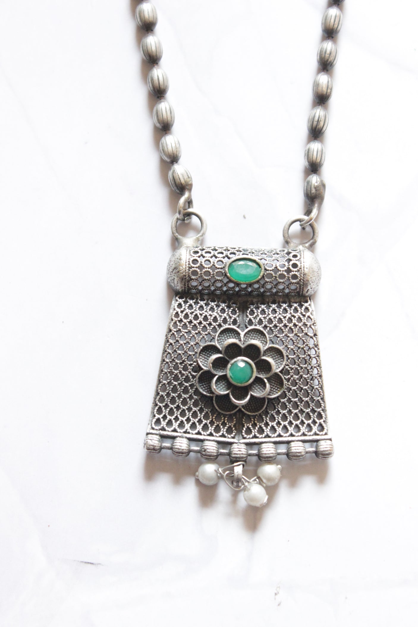 Oxidised Finish Dholki Beads German Silver Necklace with Green Center Stone