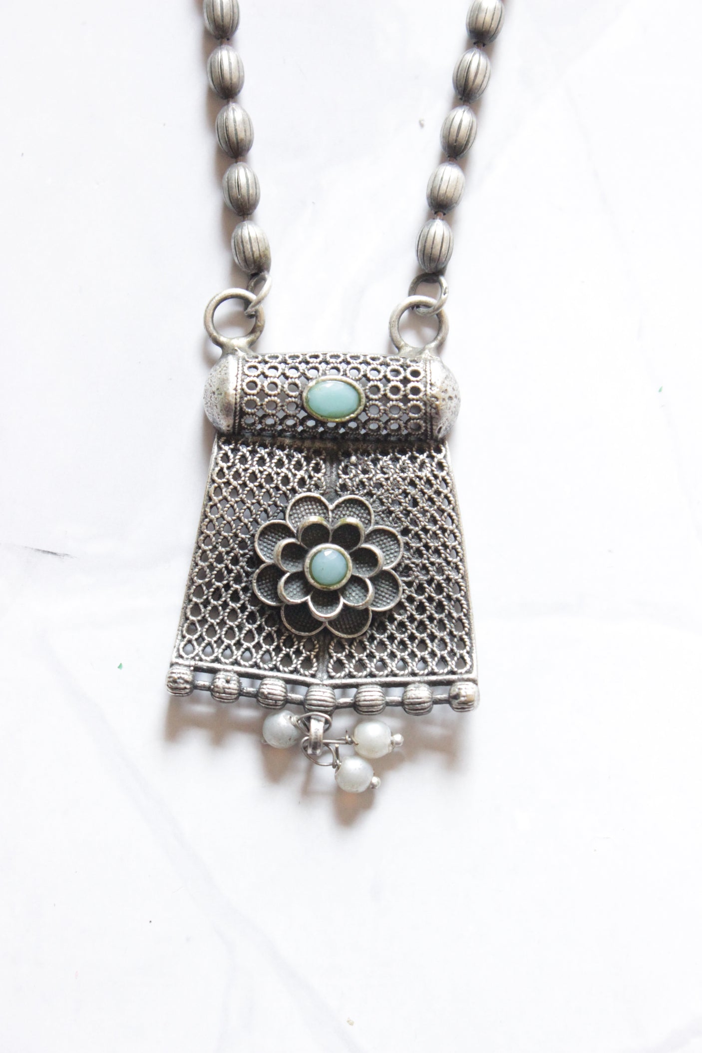 Oxidised Finish Dholki Beads German Silver Necklace with Blue Center Stone