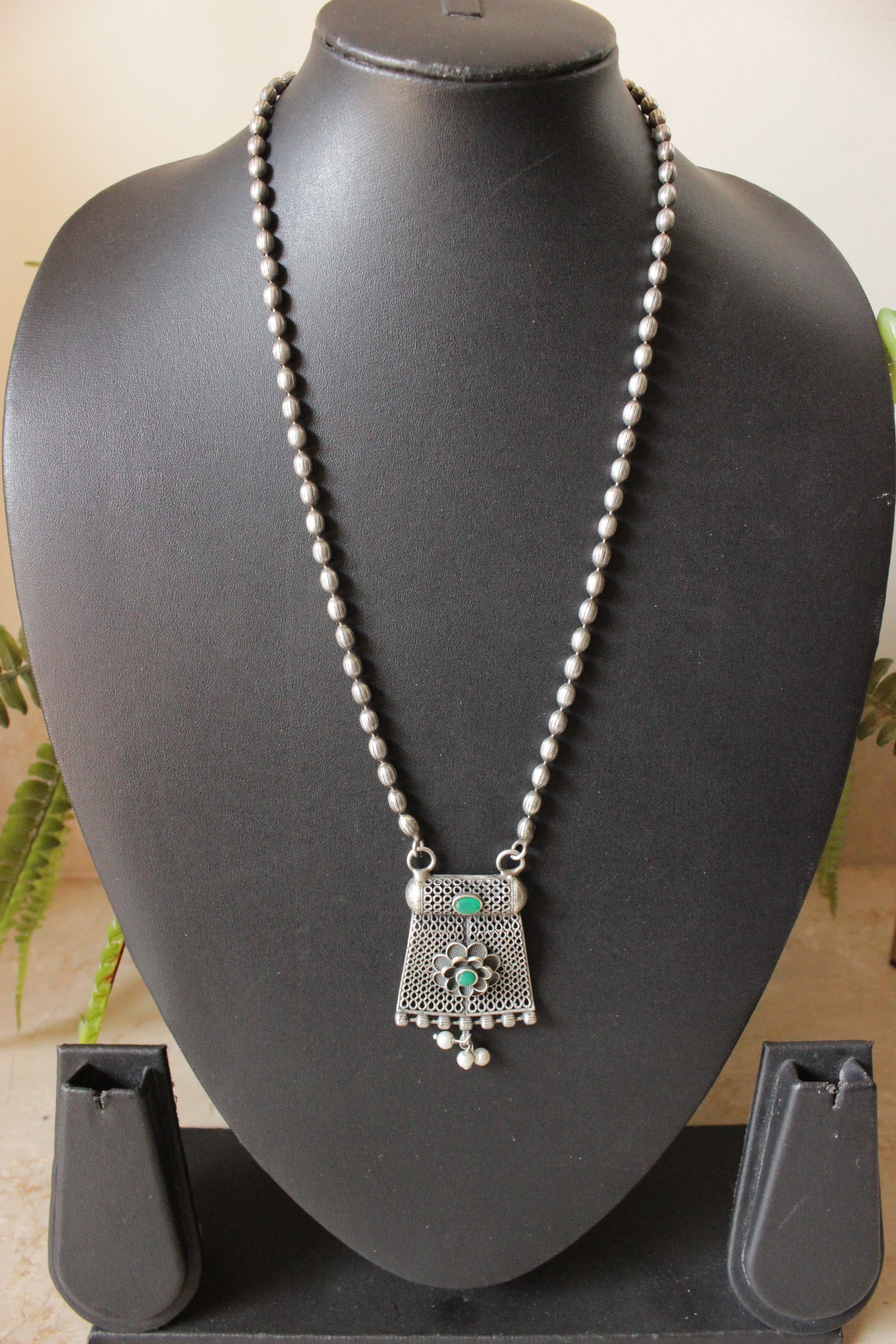 Oxidised Finish Dholki Beads German Silver Necklace with Green Center Stone