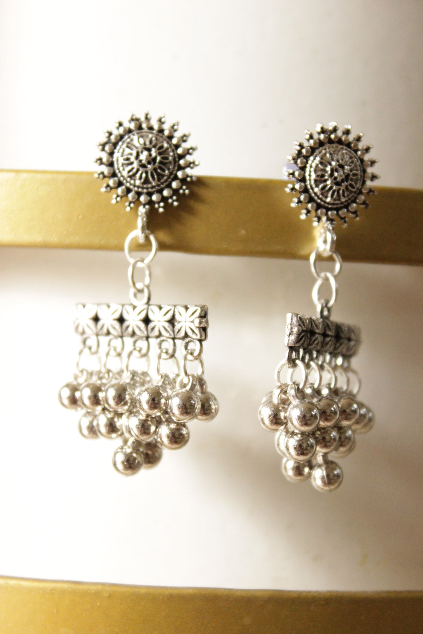 Ghungroo Beads Embellished Oxidised Finish Sun Motif Dangler Earrings