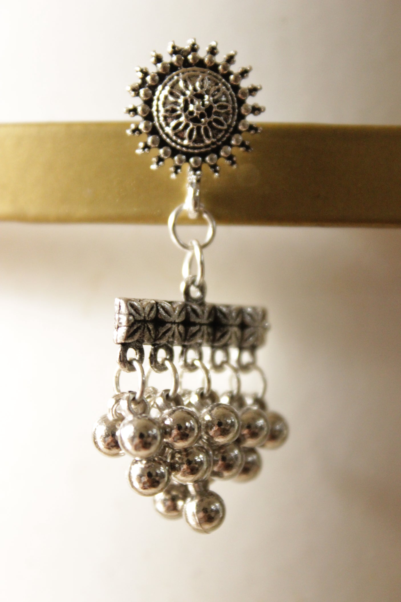 Ghungroo Beads Embellished Oxidised Finish Sun Motif Dangler Earrings