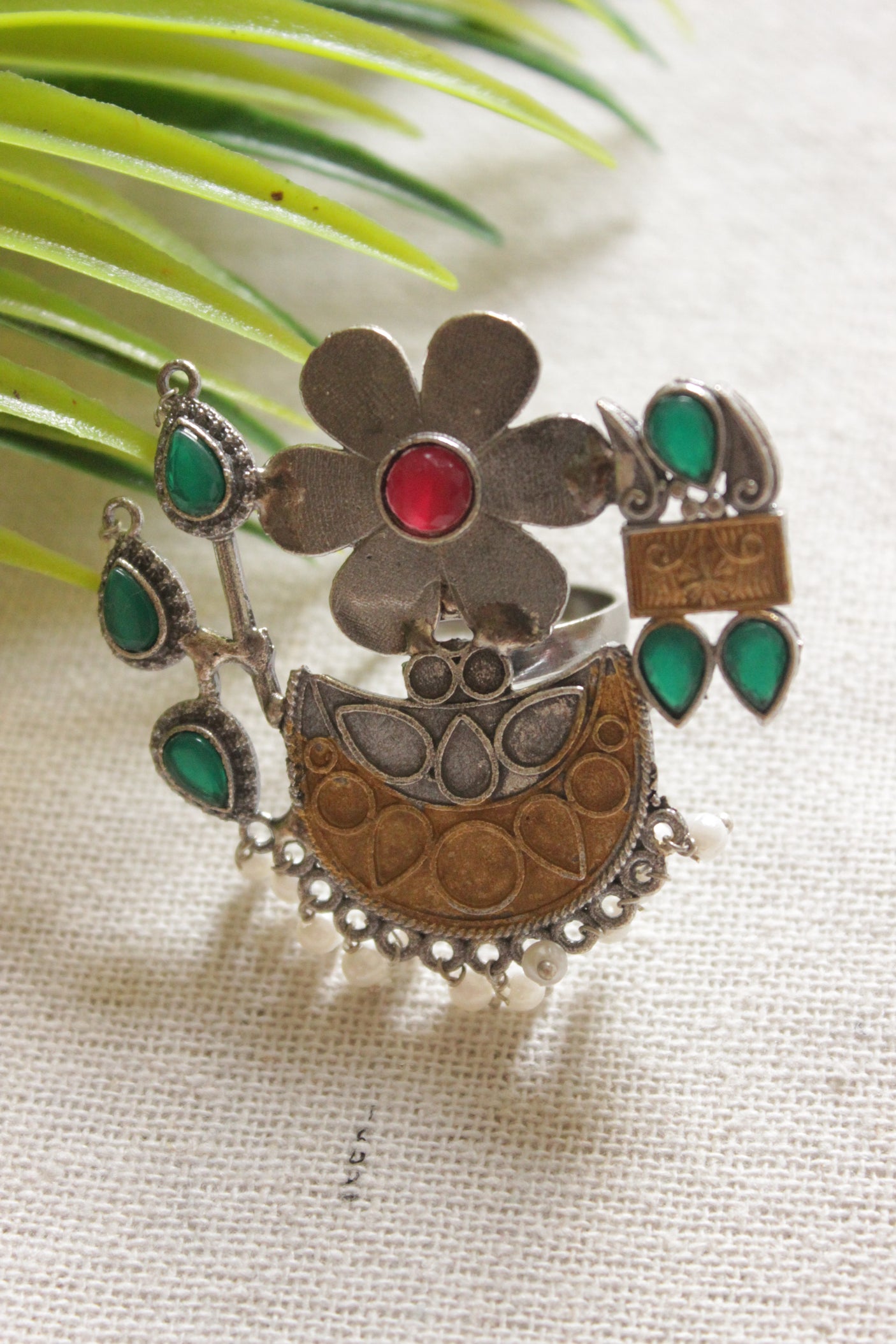 Dual Tone Premium Metal Flower Motif Green and Red Stones Embedded Statement Cocktail Ring
