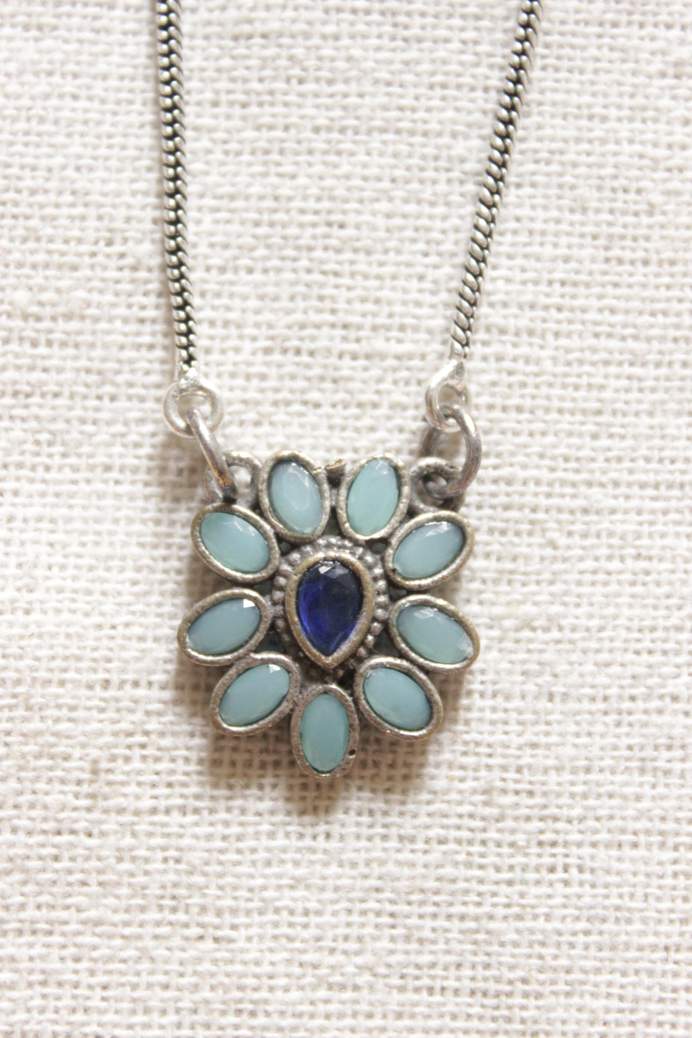 Flower Shape Petite Silver Chain Oxidised Finish Necklace Embellished with Purple and Turquoise Stones