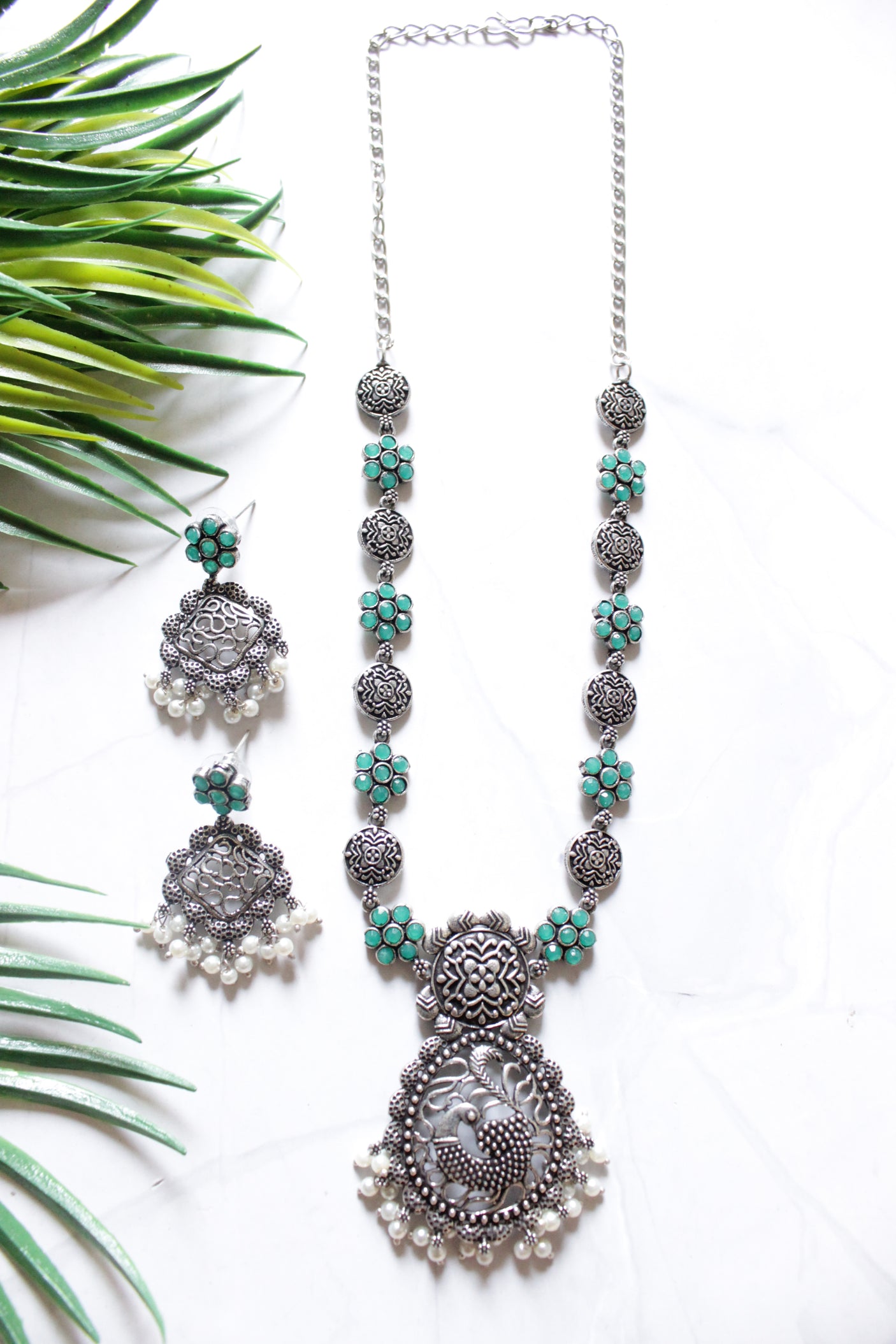 Green Stones Embedded Oxidised Finish Peacock Pendant Chain Necklace