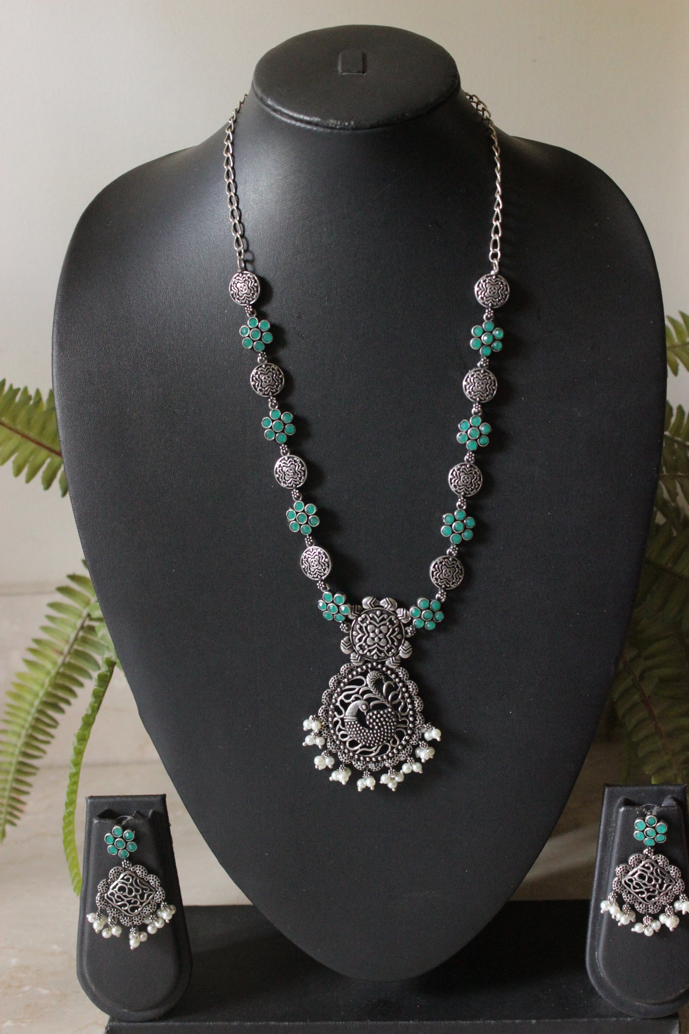 Green Stones Embedded Oxidised Finish Peacock Pendant Chain Necklace