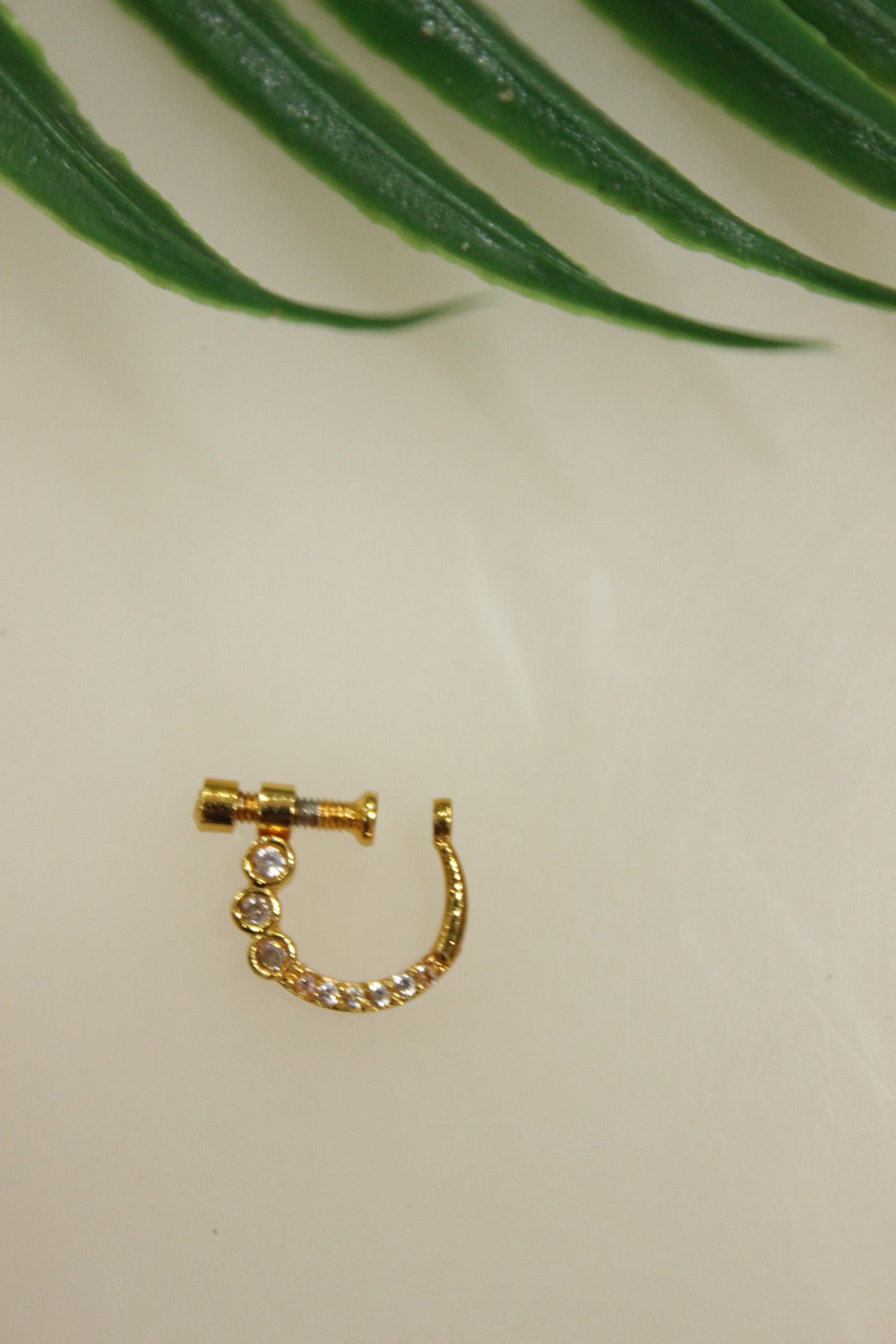White Glass Stones Embedded Gold Finish Clip On Nosepin