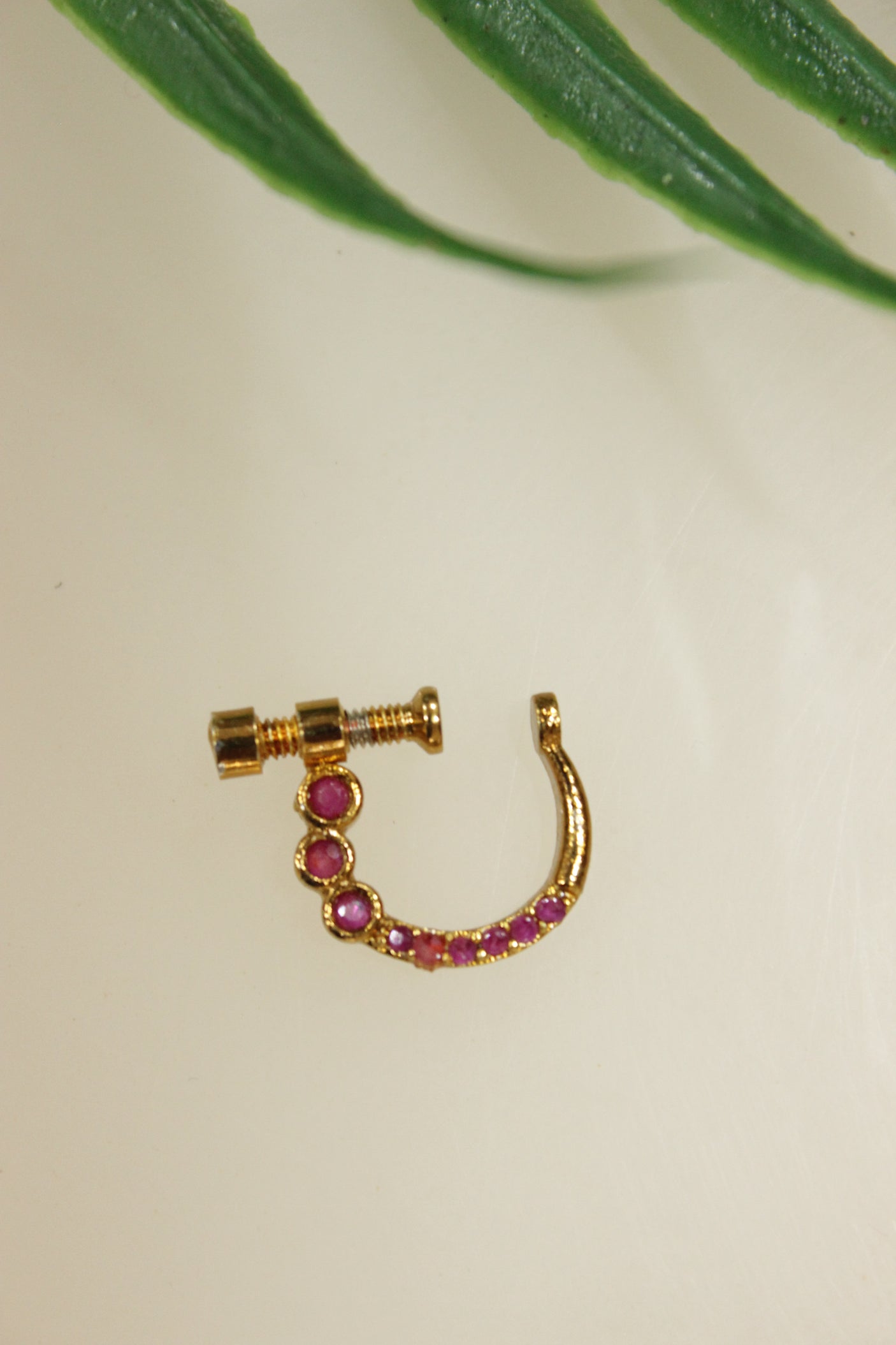 Pink Glass Stones Embedded Gold Finish Clip On Nosepin