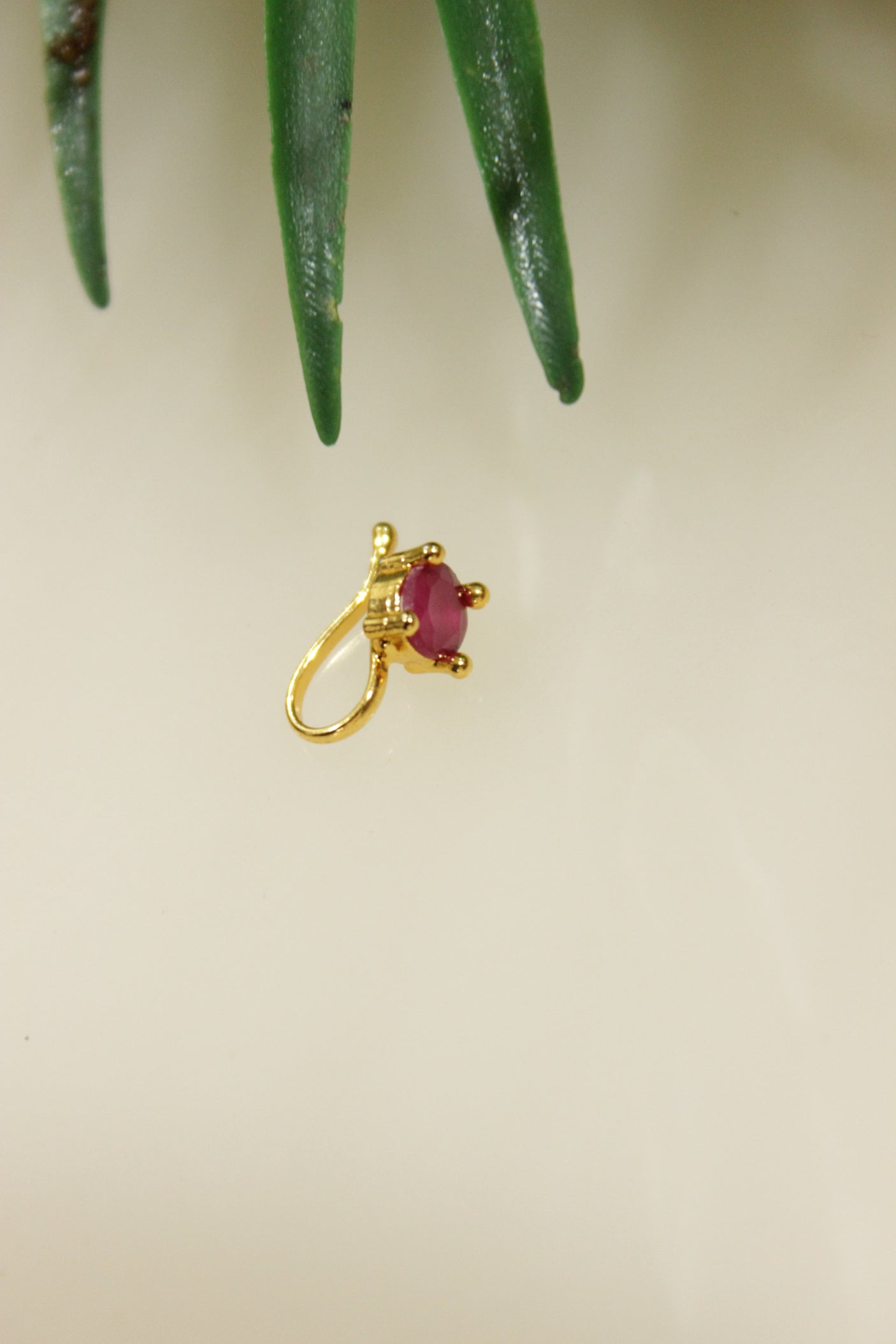 Ruby Pink Glass Stone Embedded Gold Finish Clip On Nosepin