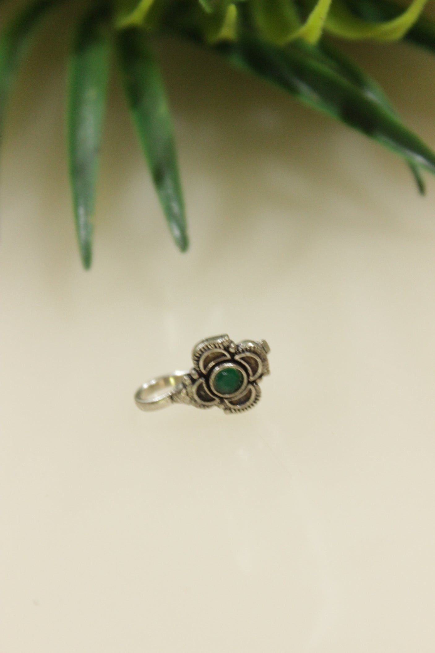 Blue Center Stone Embedded Flower Shape Oxidised Finish Clip On Nosepin