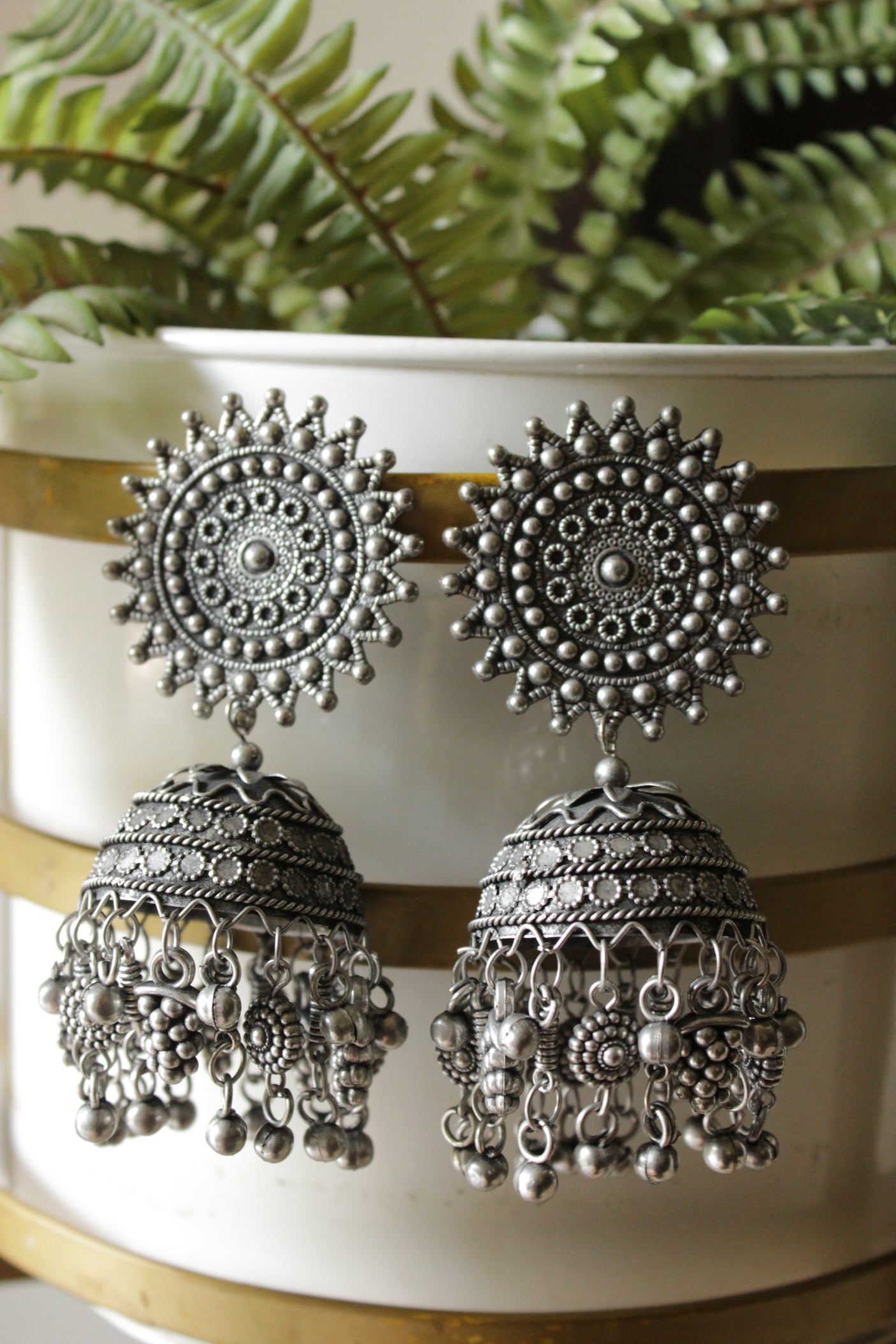 Intricately Detailed Premium Oxidised Finish Sun Dial Jhumka Earrings
