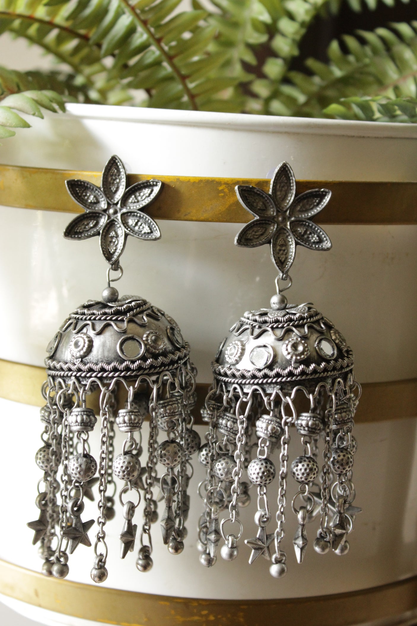 Premium Oxidised Finish Flower Jhumka Earrings with Long Metal Charm Strings