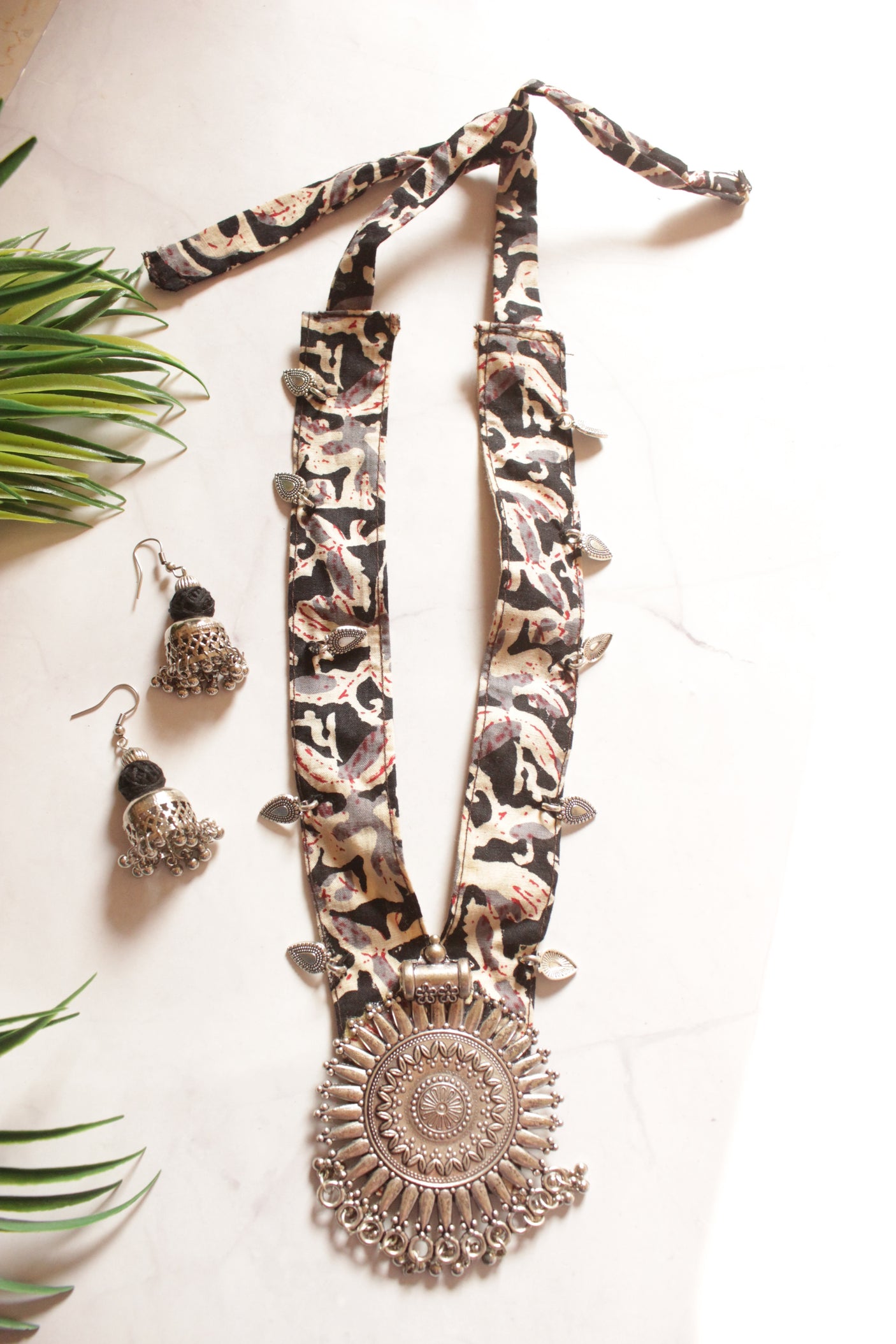 Black Kalamkari Fabric Necklace Embellished with Metal Charms