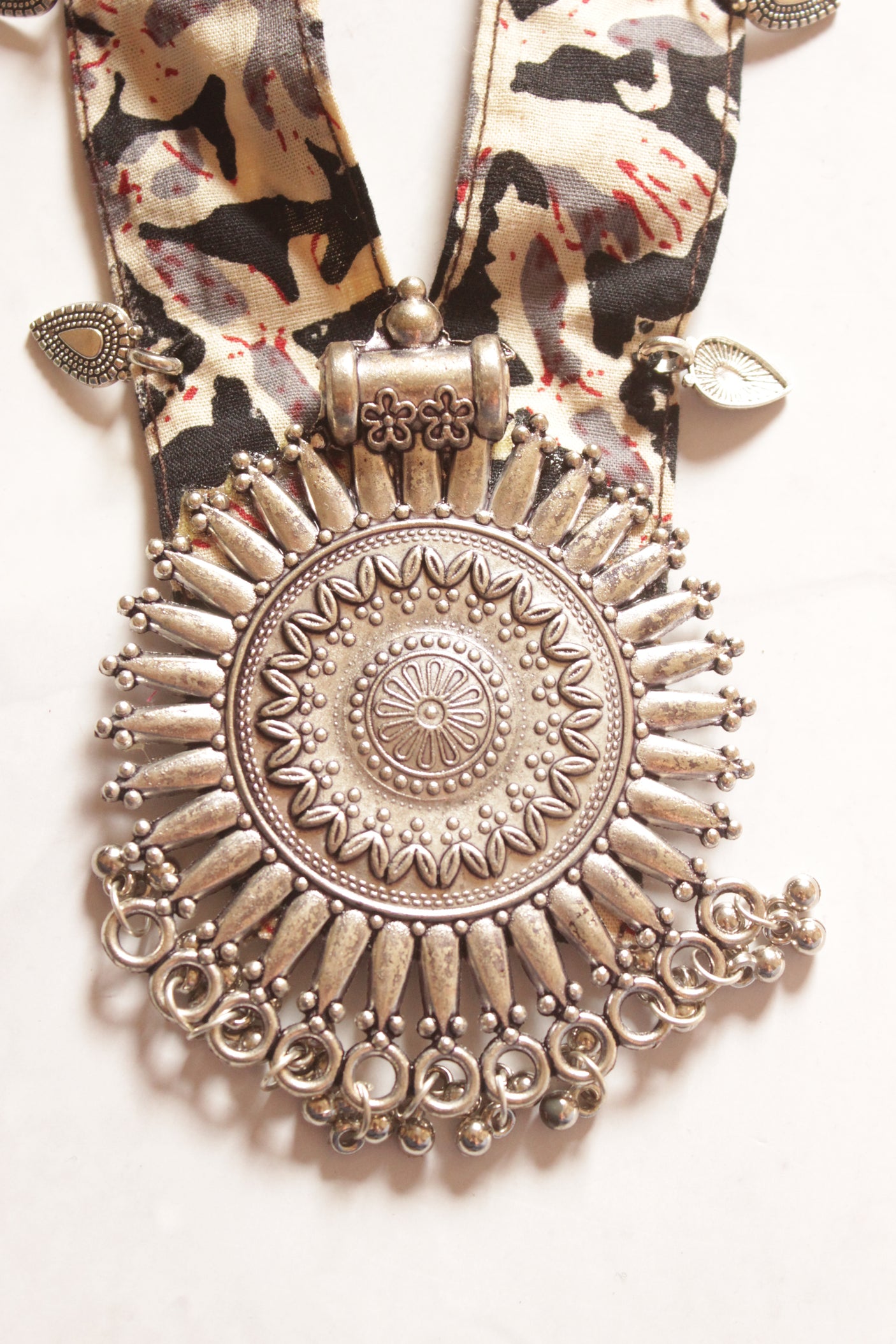 Black Kalamkari Fabric Necklace Embellished with Metal Charms