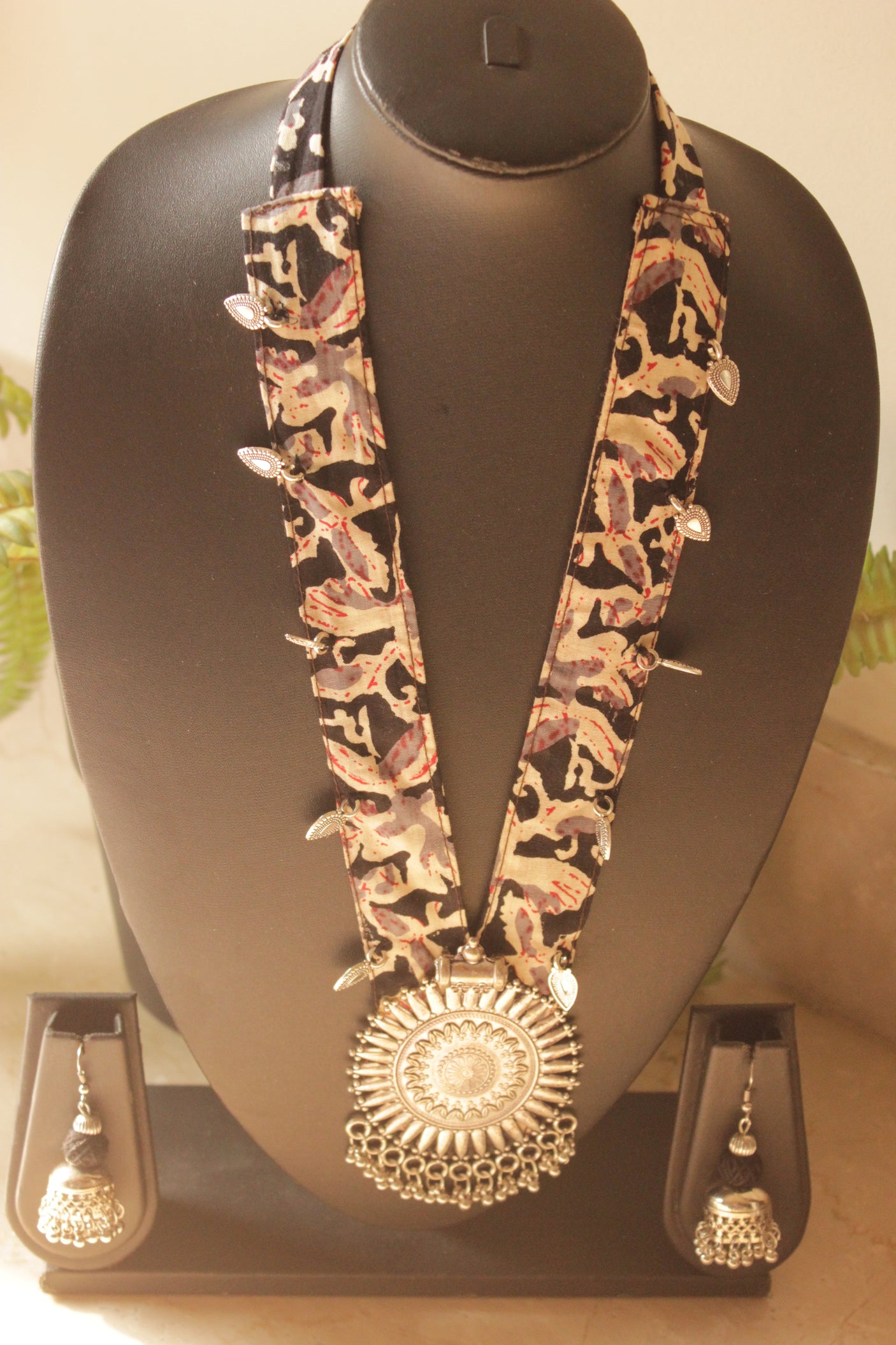 Black Kalamkari Fabric Necklace Embellished with Metal Charms