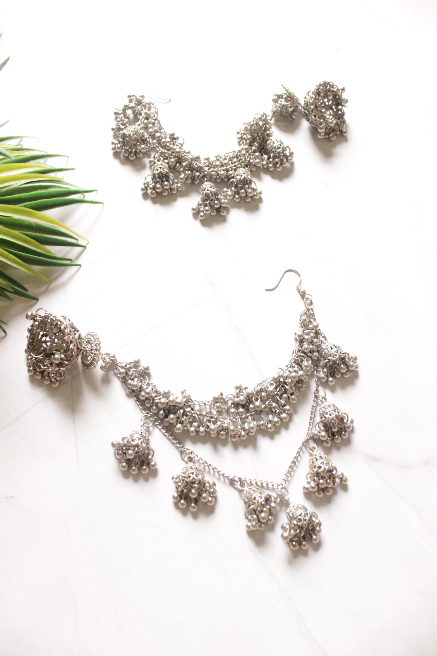 Silver Metal Jhumka with Statement Hair String Attachments