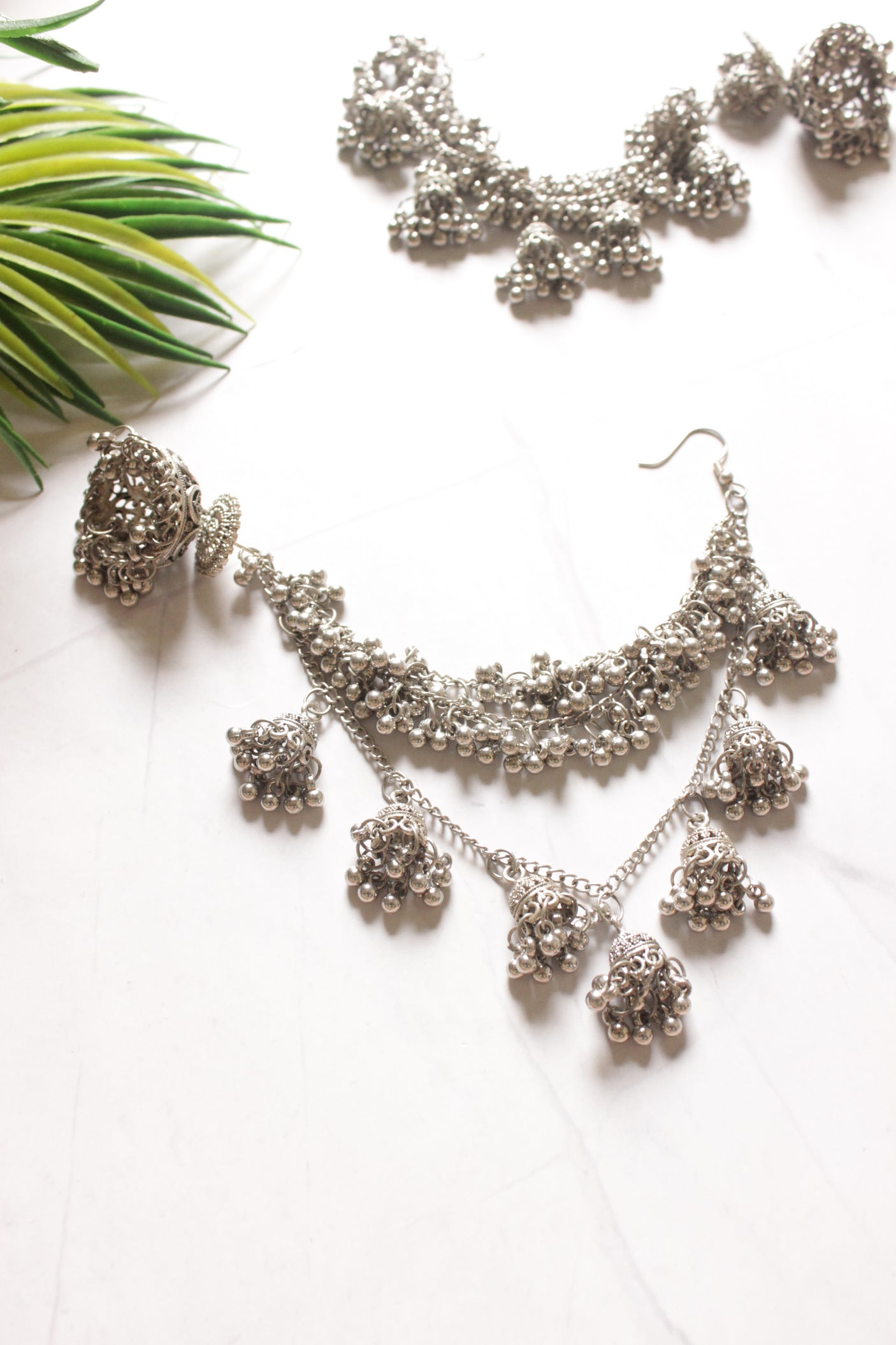 Silver Metal Jhumka with Statement Hair String Attachments