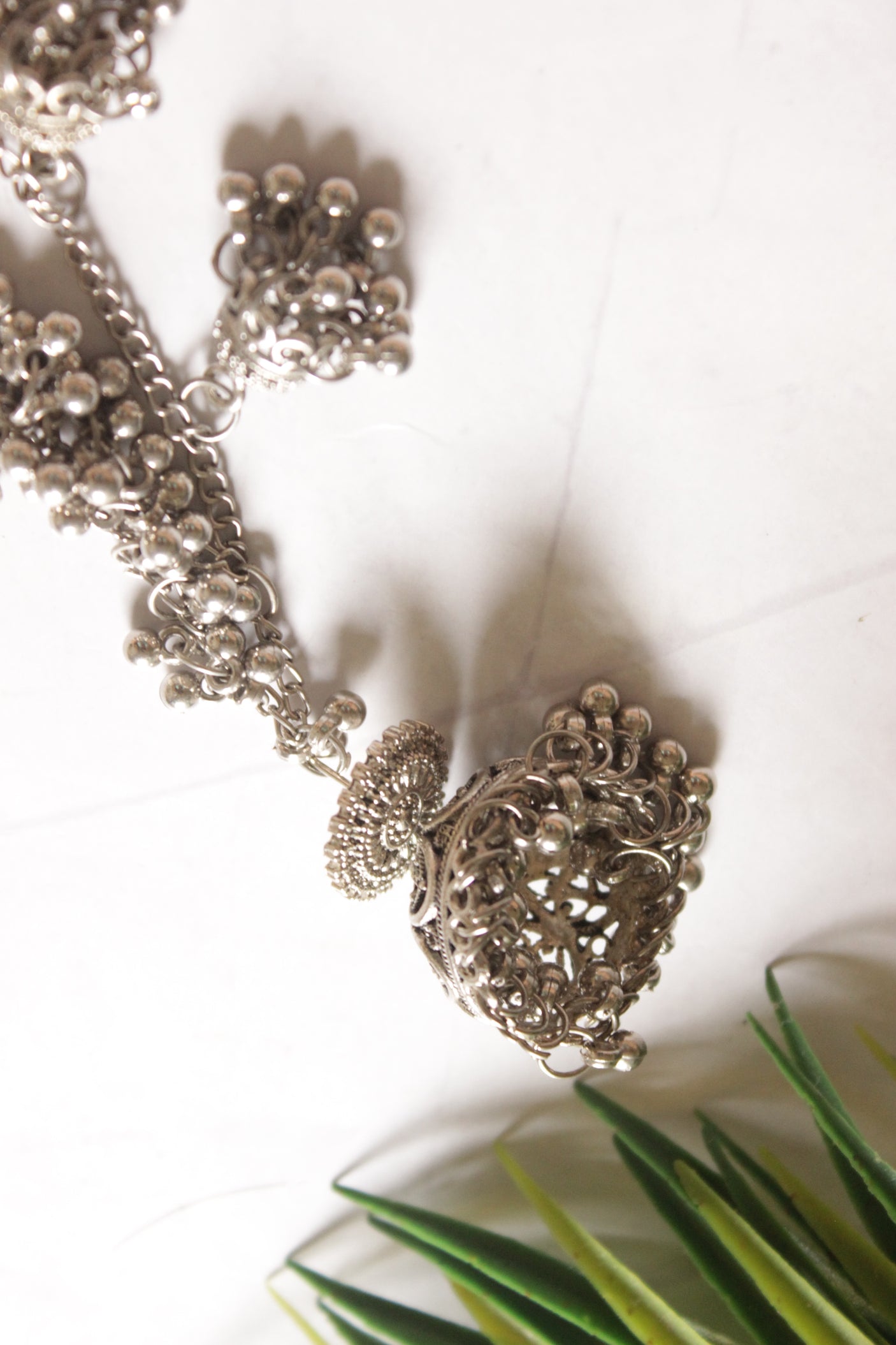 Silver Metal Jhumka with Statement Hair String Attachments