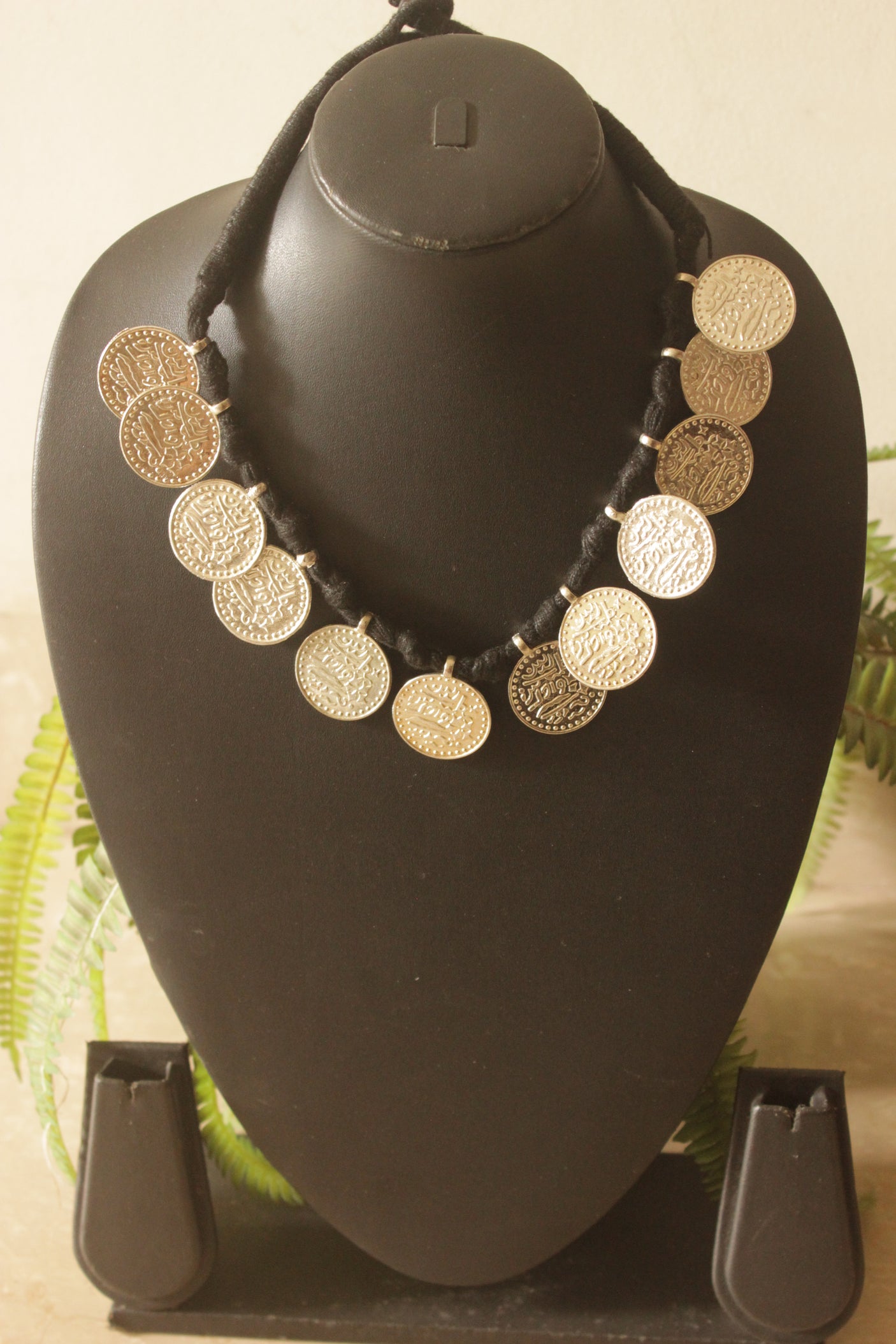 Stamped Metal Coins Braided in Black Fabric Threads Necklace