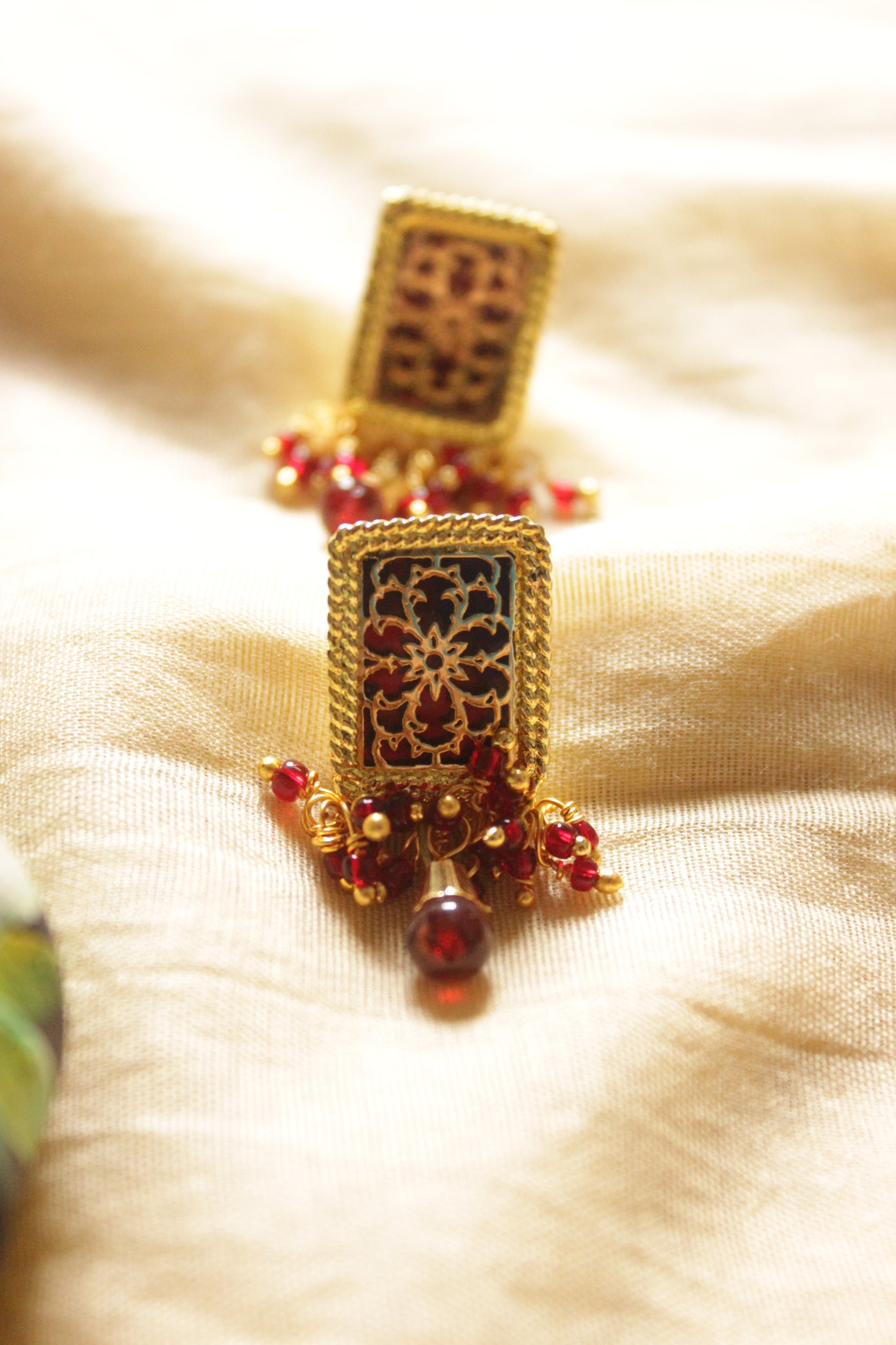 Intricately Detailed Gold Toned Rectangular Pendant Necklace Set with Multi-Layer Red Beads Closure