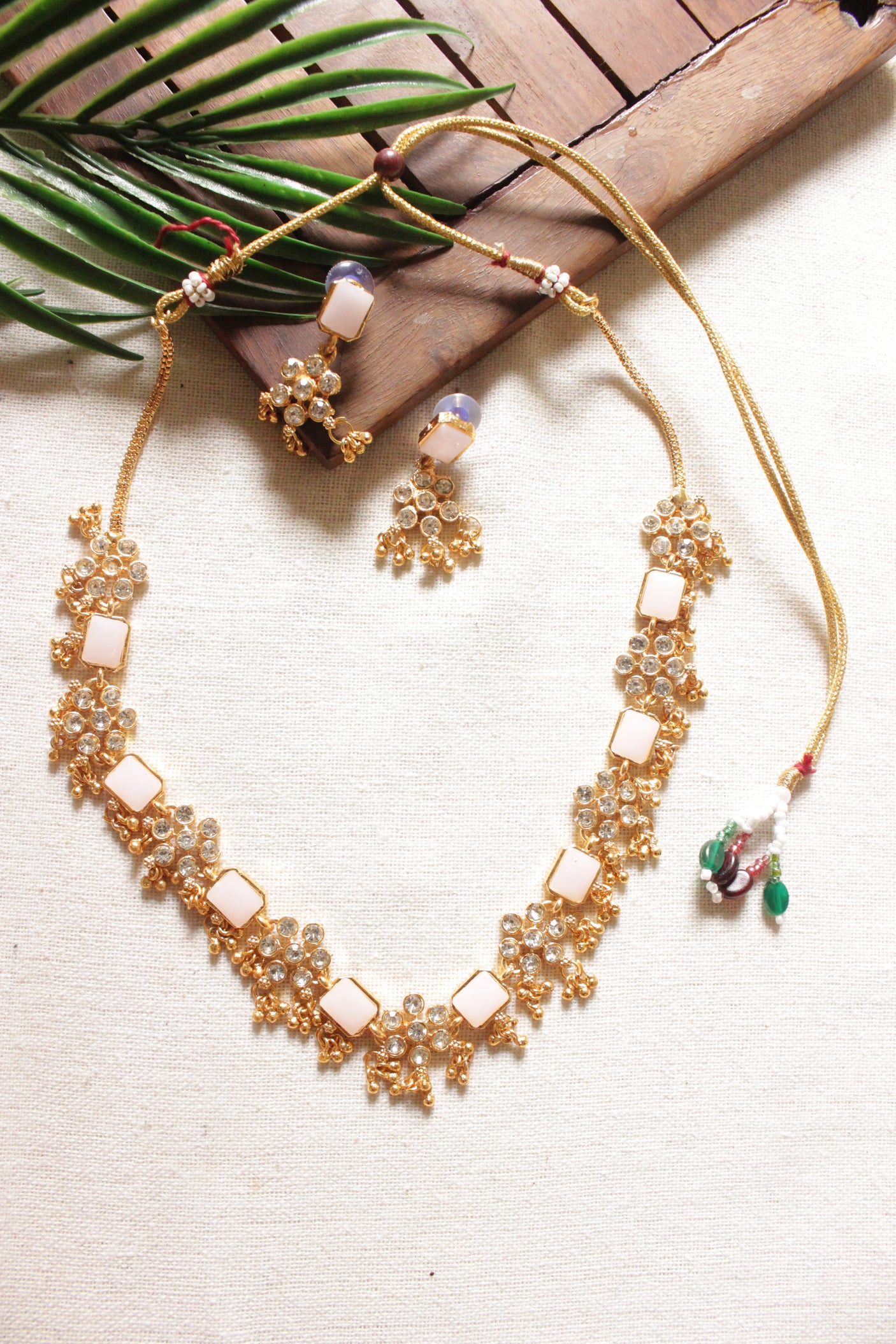 Ivory Natural Gemstones Embedded Gold Toned Choker Necklace Set with Adjustable Closure