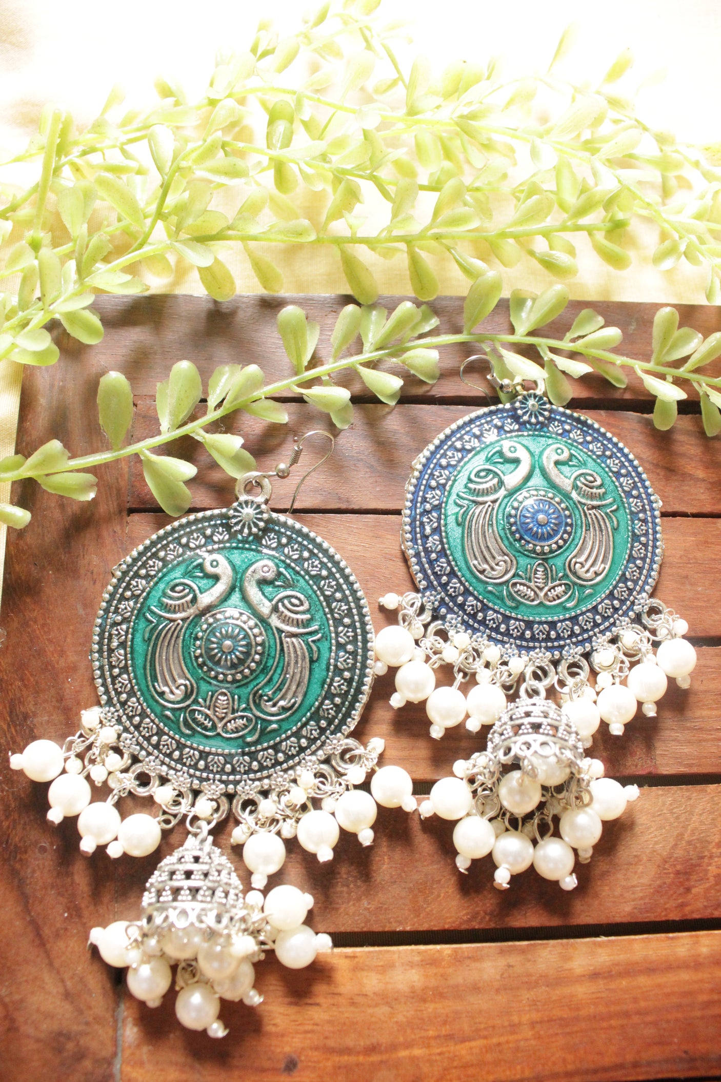 Turquoise Enamel Painted Intricately Detailed Oxidised Finish Peacock Motif Jhumka Earrings