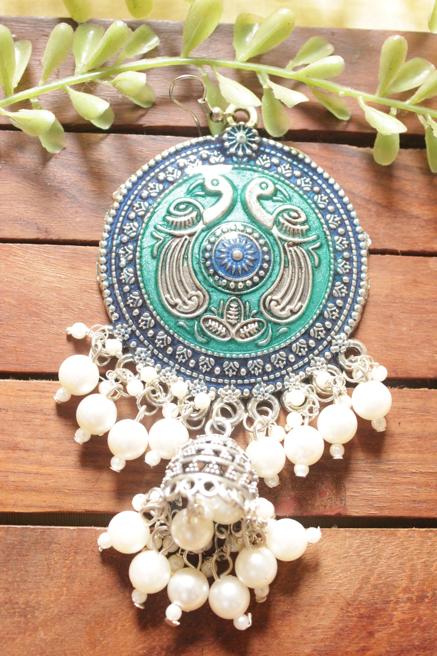 Turquoise Enamel Painted Intricately Detailed Oxidised Finish Peacock Motif Jhumka Earrings