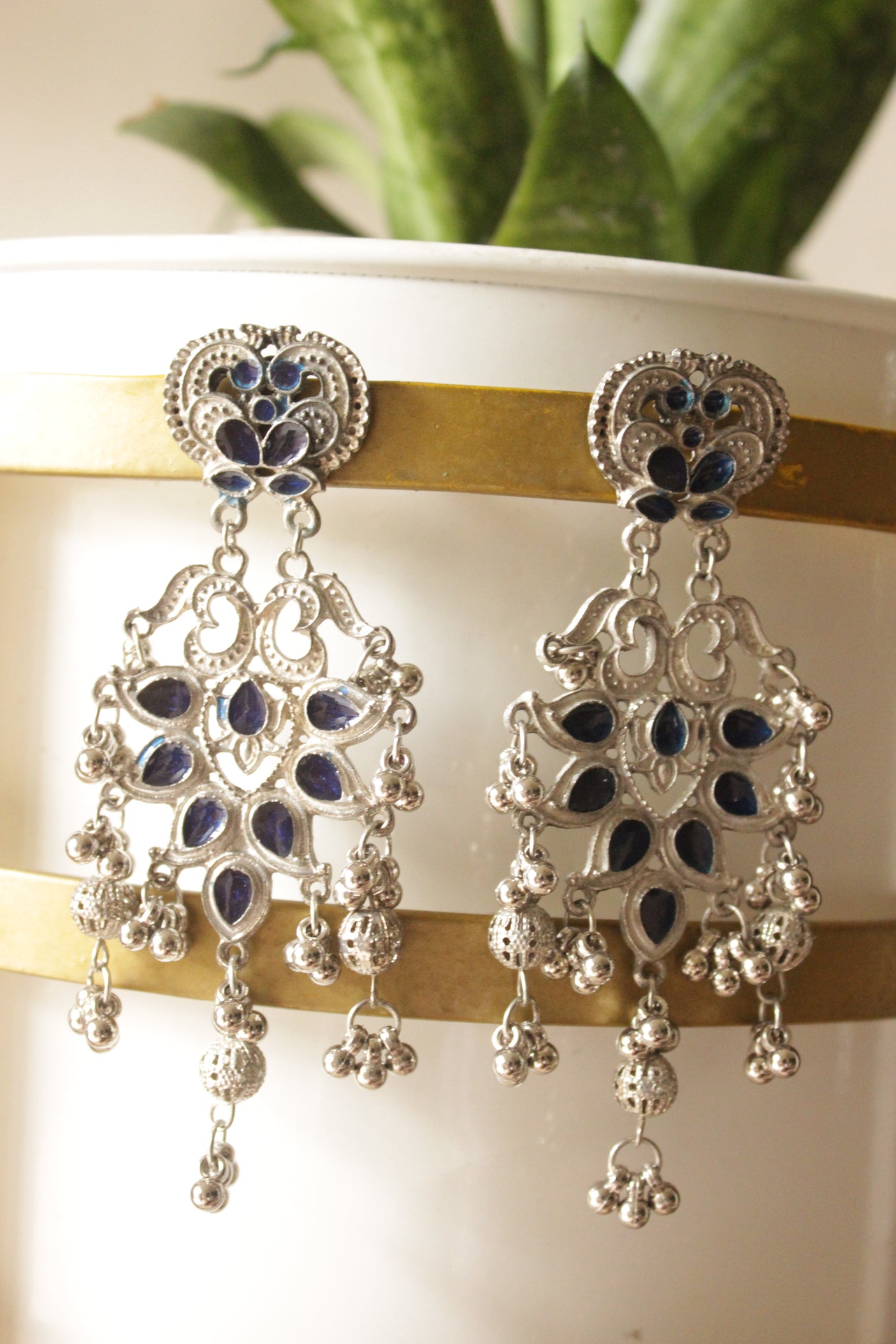Violet Glass Stones Embedded Silver Finish Elaborate Festive Metal Earrings