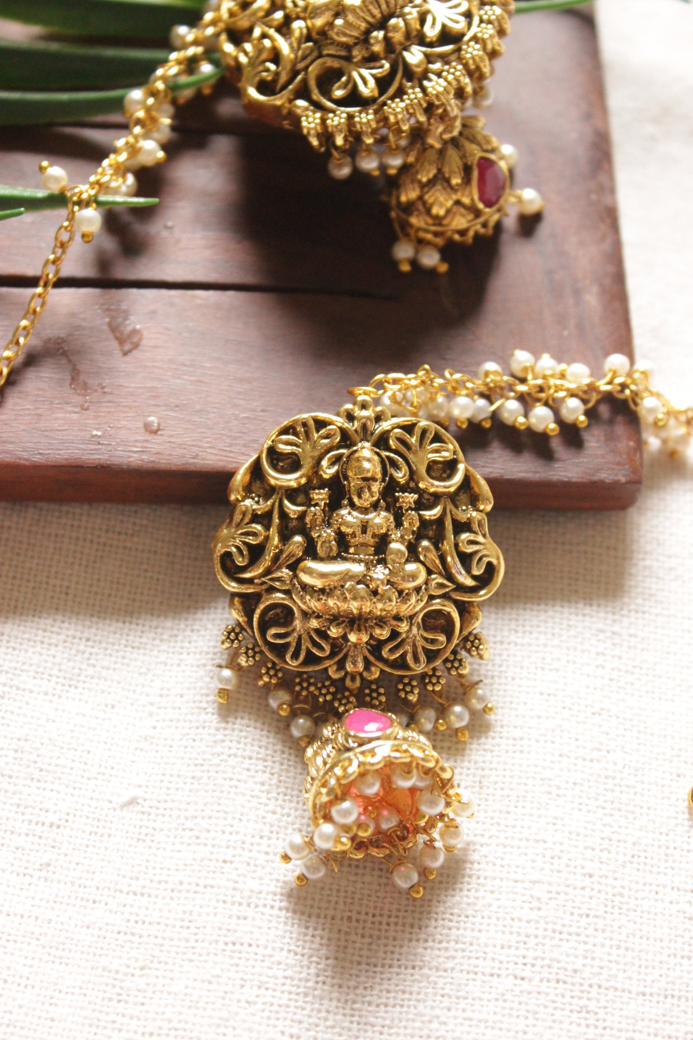 Religious Motifs Dull Gold Finish Temple Jewelry Jhumka Earrings with Ear Chain