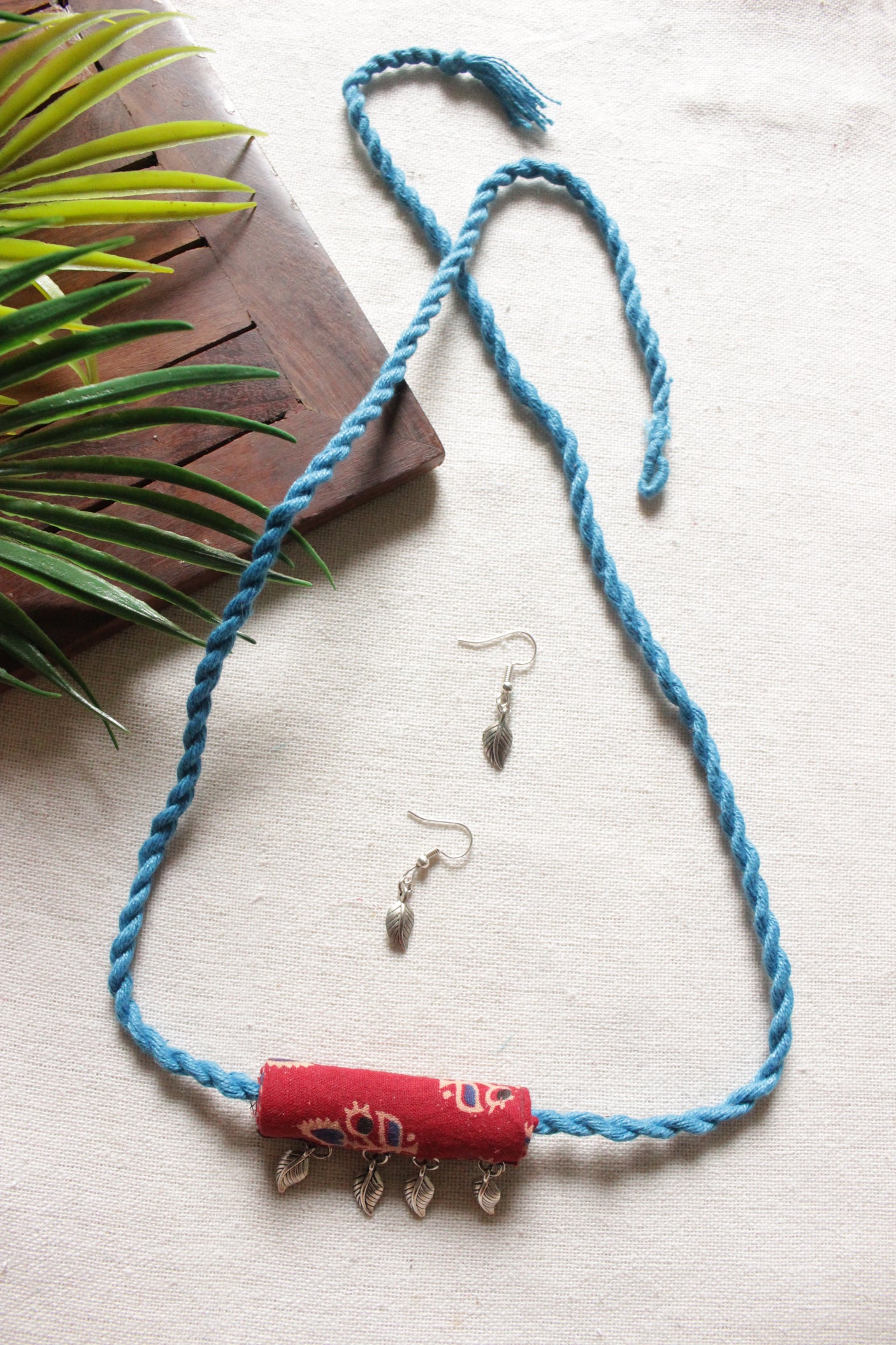 Maroon Kalamkari Fabric Necklace Set Embellished with Leaf Metal Charms