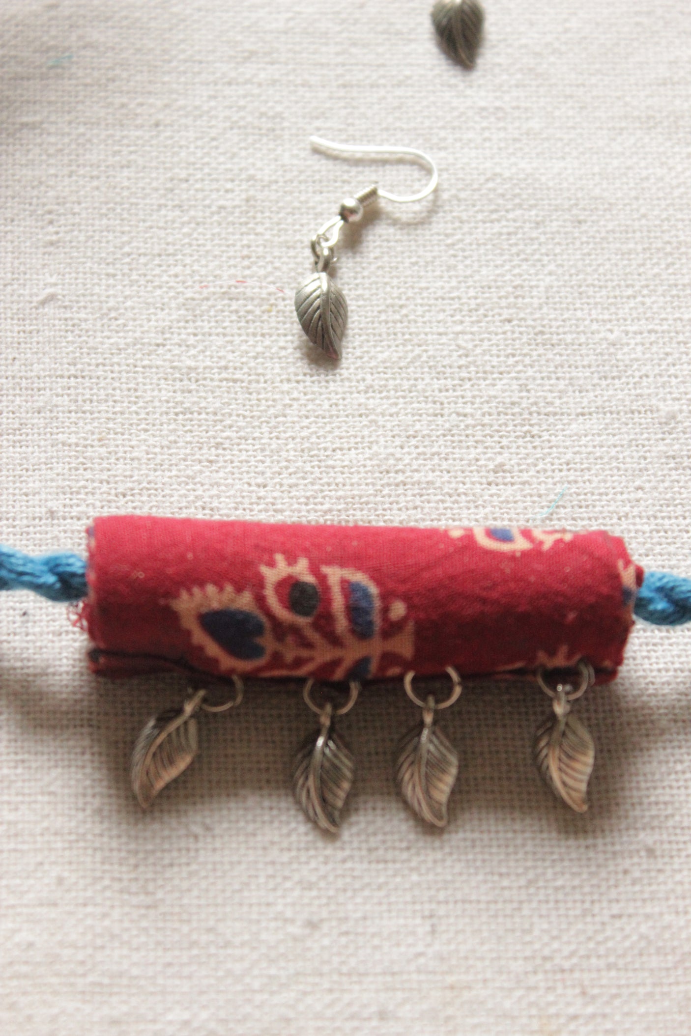 Maroon Kalamkari Fabric Necklace Set Embellished with Leaf Metal Charms