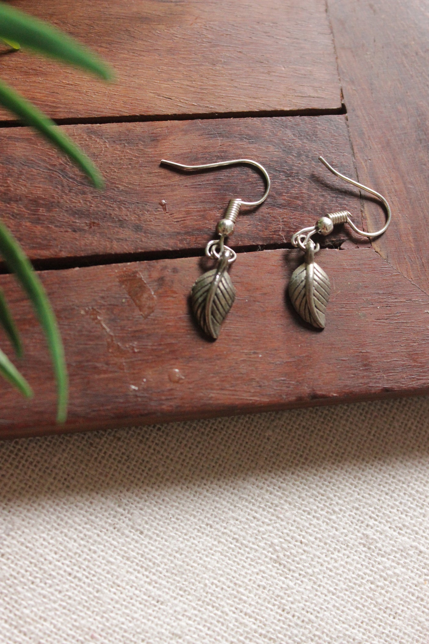 Maroon Kalamkari Fabric Necklace Set Embellished with Leaf Metal Charms