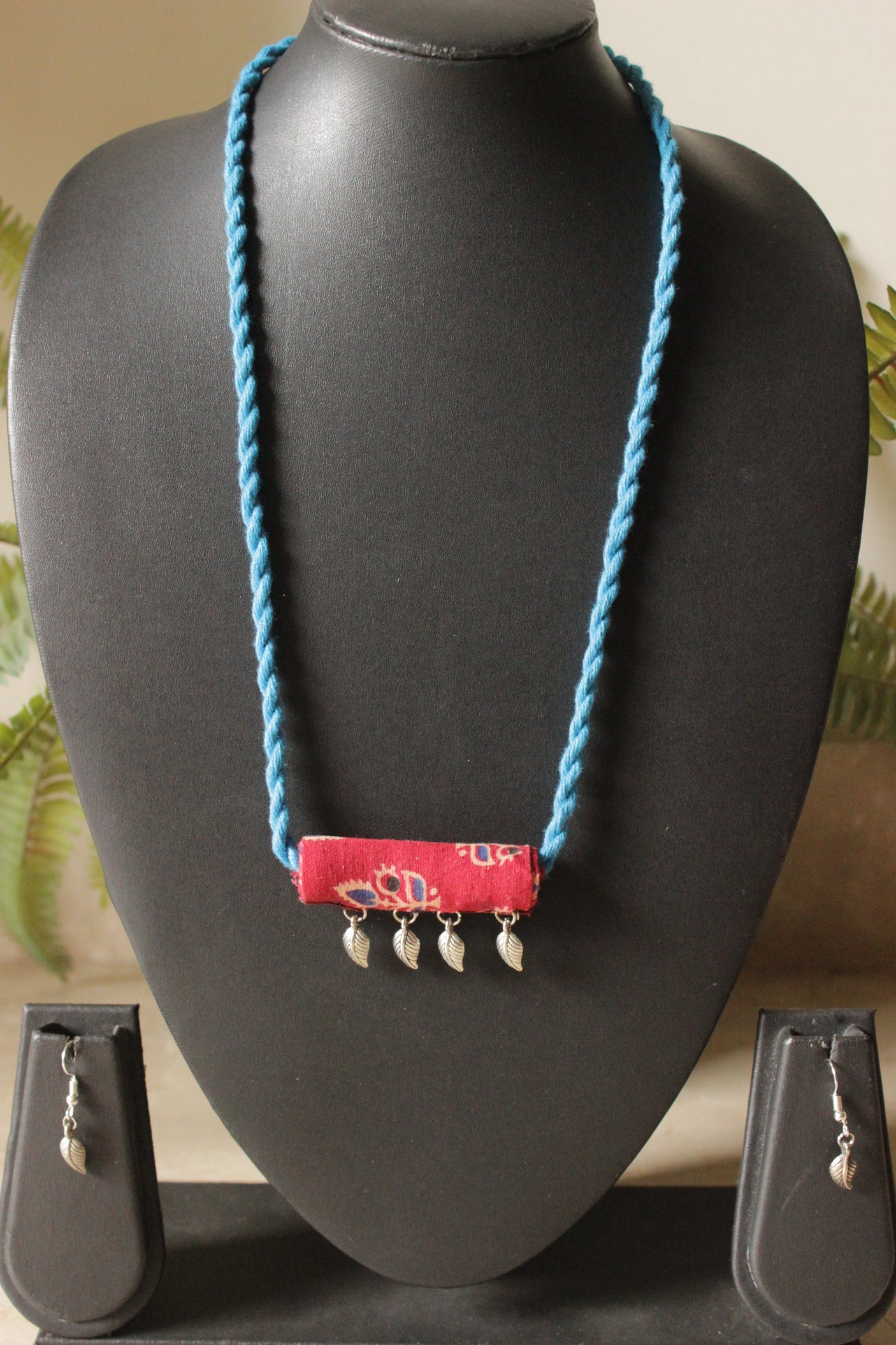 Maroon Kalamkari Fabric Necklace Set Embellished with Leaf Metal Charms