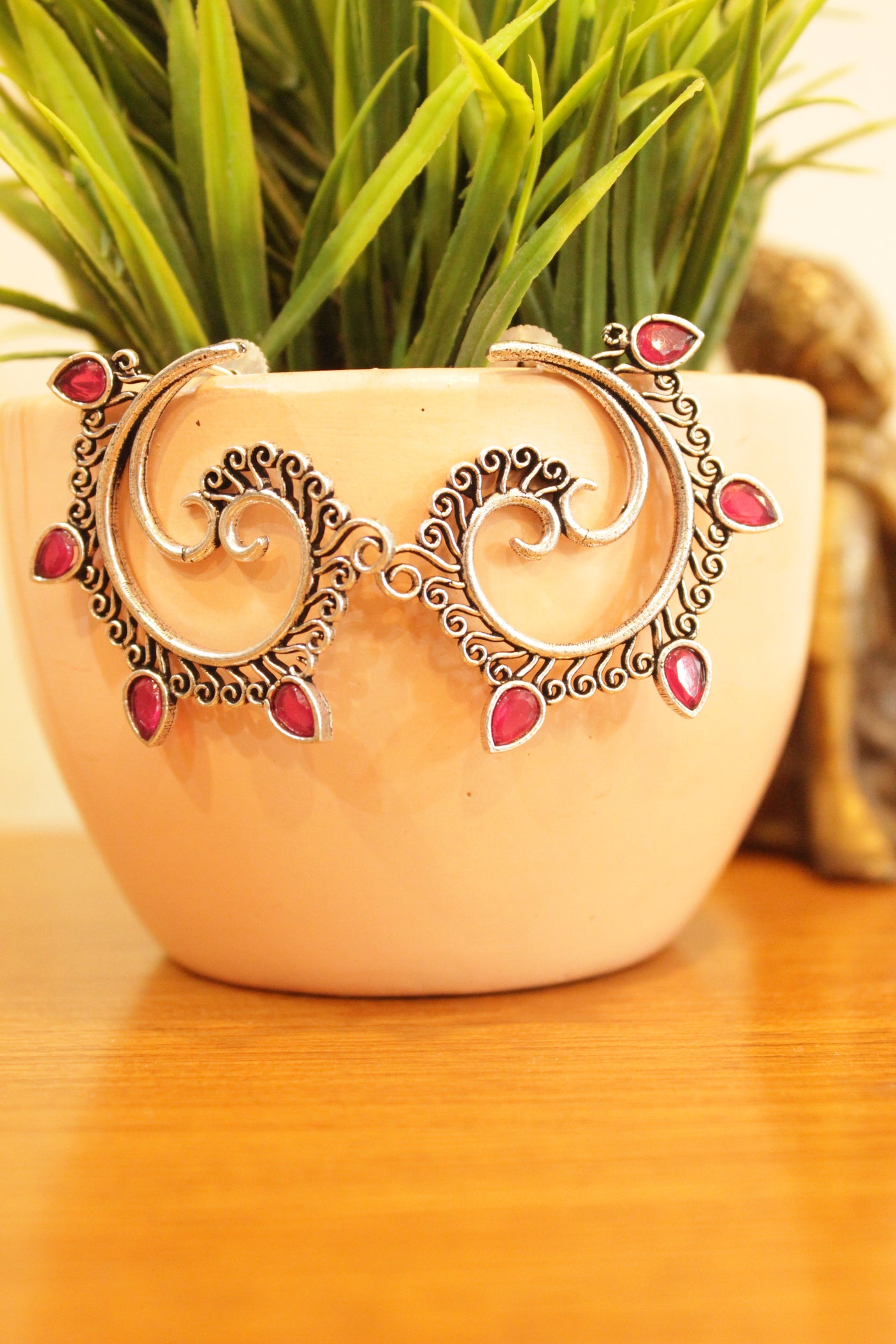 Fuchsia Stones Embedded Oxidised Finish Spiral Peacock Earrings