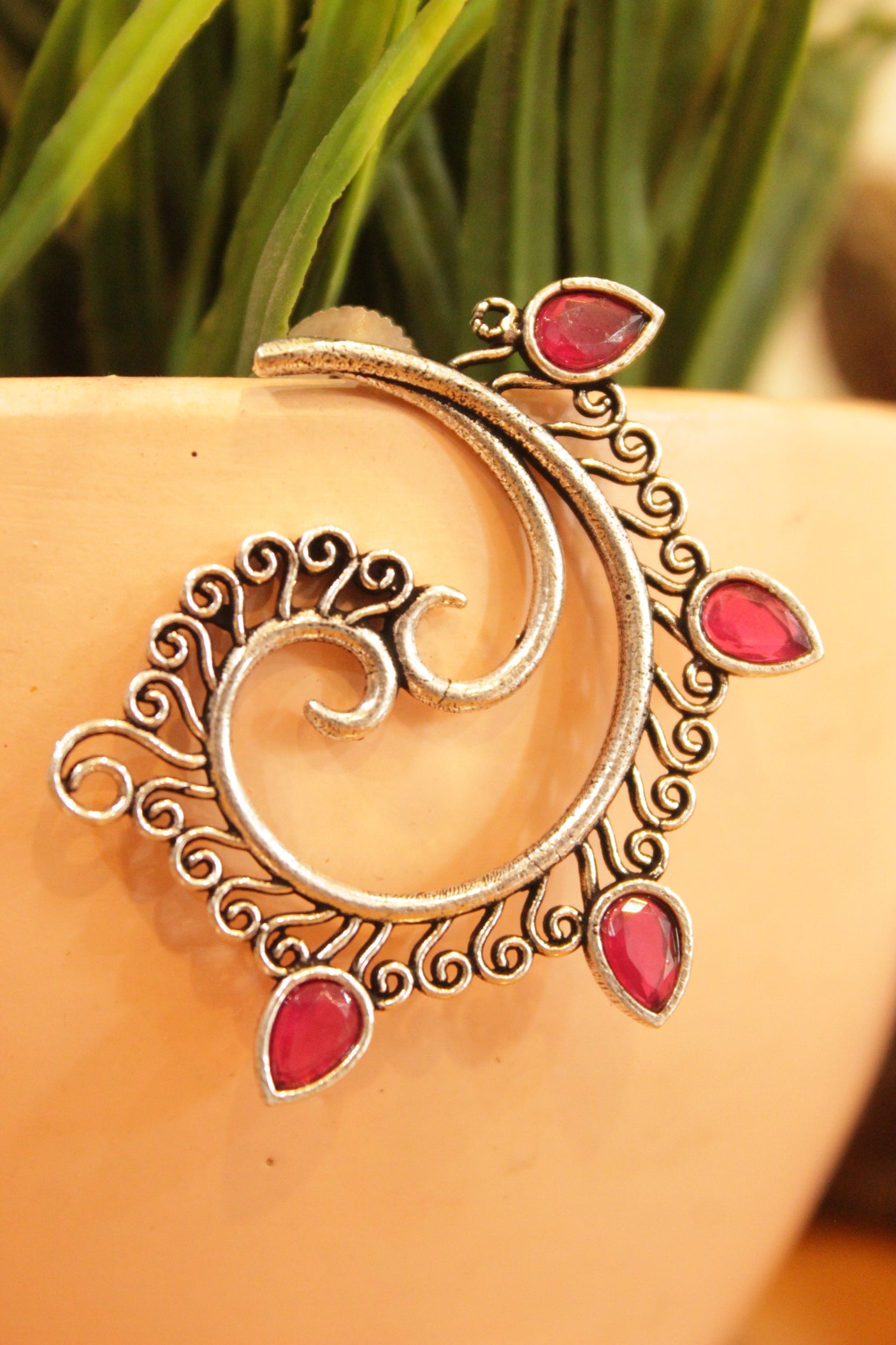 Fuchsia Stones Embedded Oxidised Finish Spiral Peacock Earrings