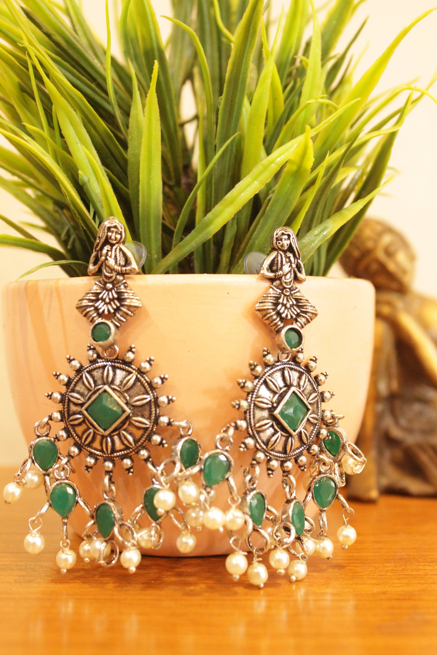 Green Stones Embedded Chakra Motif Oxidised Finish Earrings