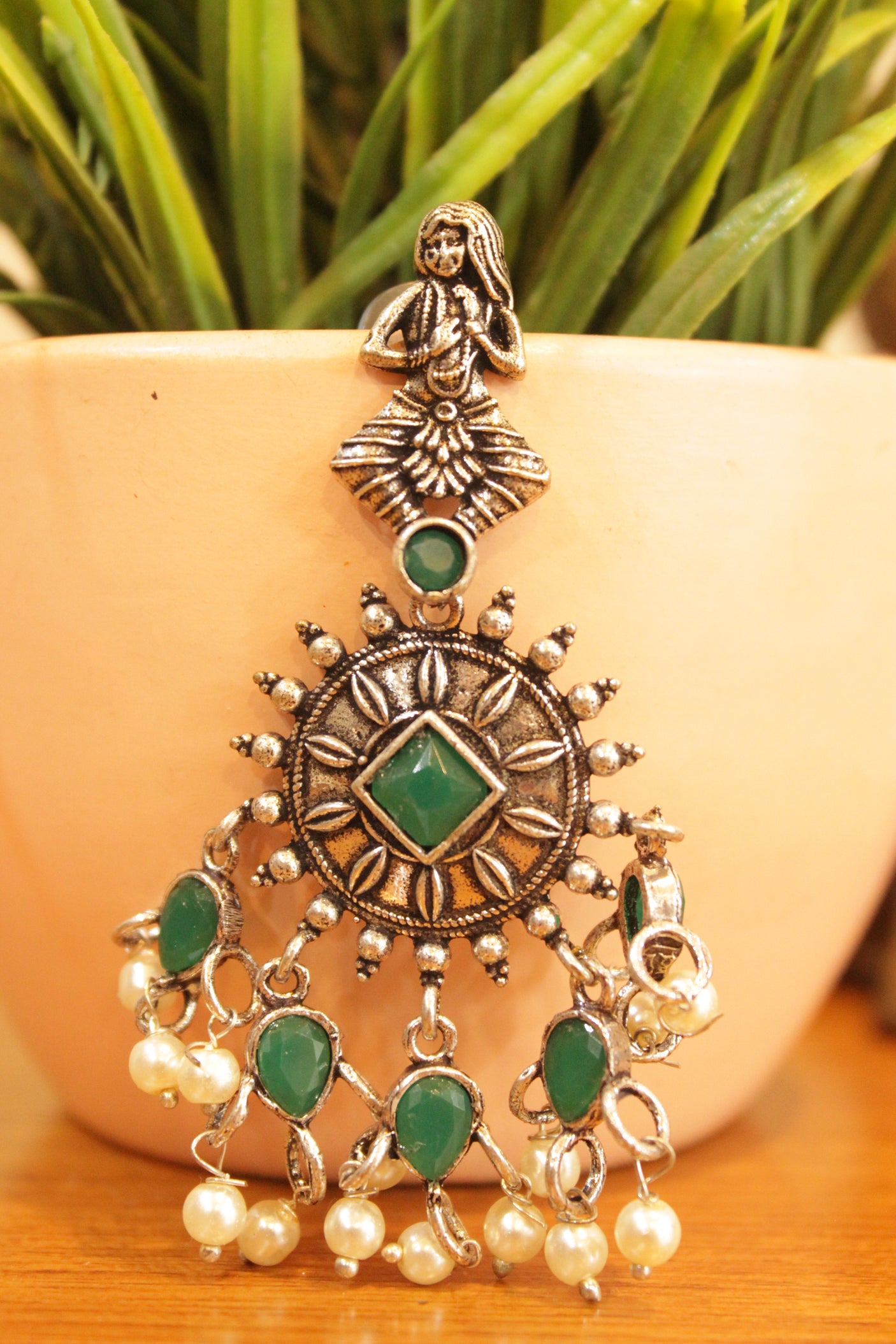 Green Stones Embedded Chakra Motif Oxidised Finish Earrings