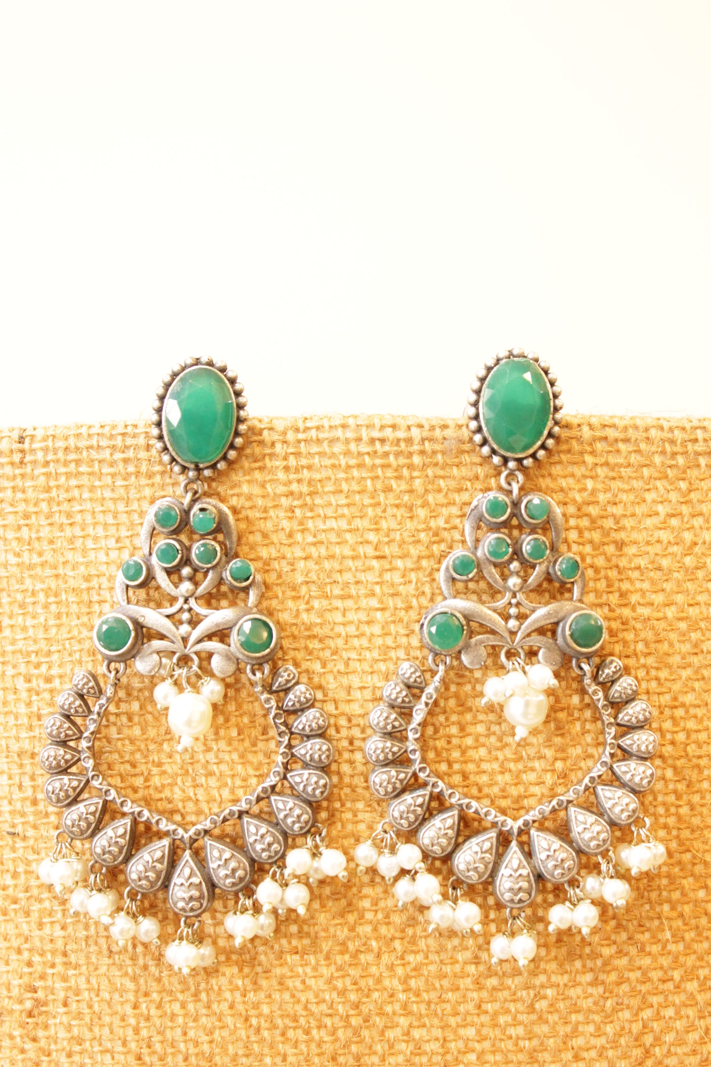 Green Glass Stones Embedded Oxidised Finish Statement Earrings Accentuated with White Beads